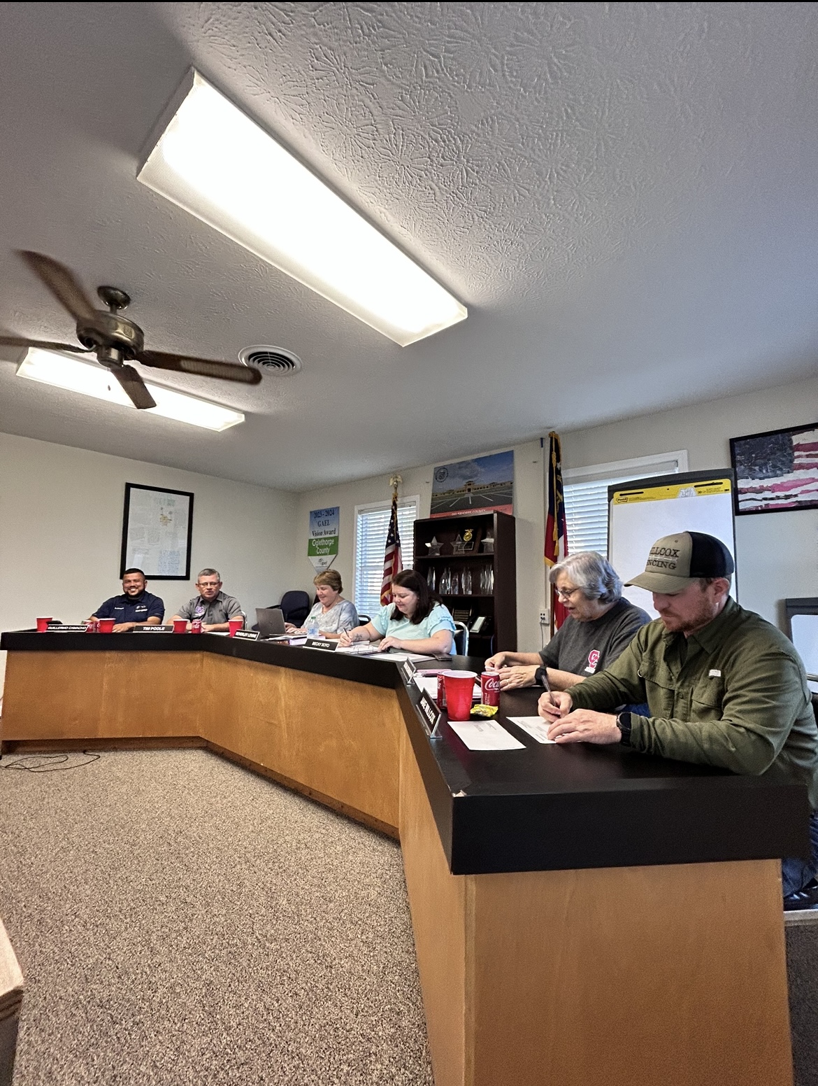 Guillermo Camacho (from left), Tim Poole, Beverley Levine, Becky Soto, Susan Robinson and Jake Willcox listen during the Oglethorpe County Board of Education meeting on Tuesday. The board discussed a 67% increase in withdrawals and ways parents and the community can financially give back to the school system. (McCain Bracewell/The Oglethorpe Echo)