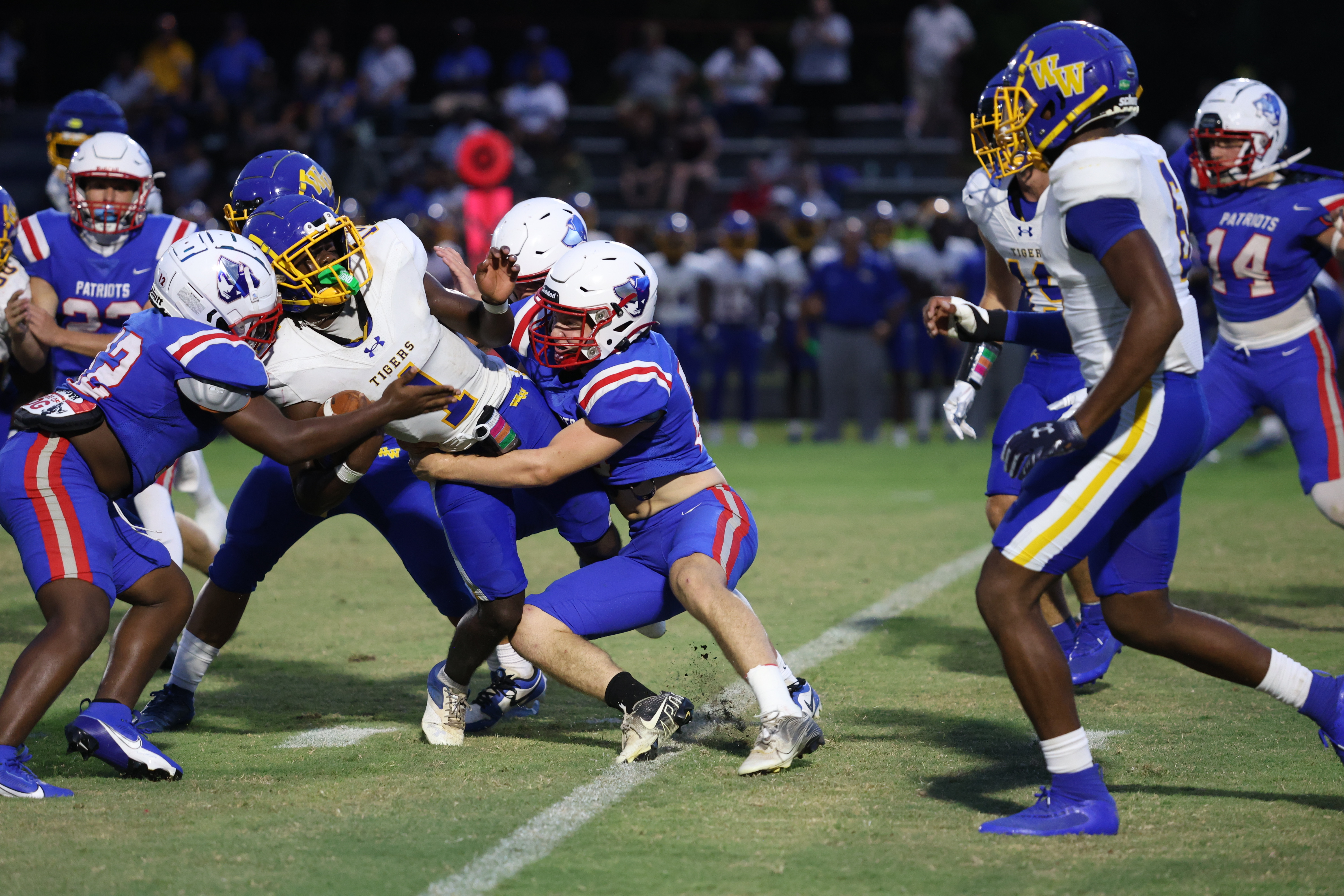 Oglethorpe County defenders wrap up a Washington-Wilkes runner during the Tigers’ 20-17 victory over the Patriots. The Tigers won on a last-second field goal attempt. 