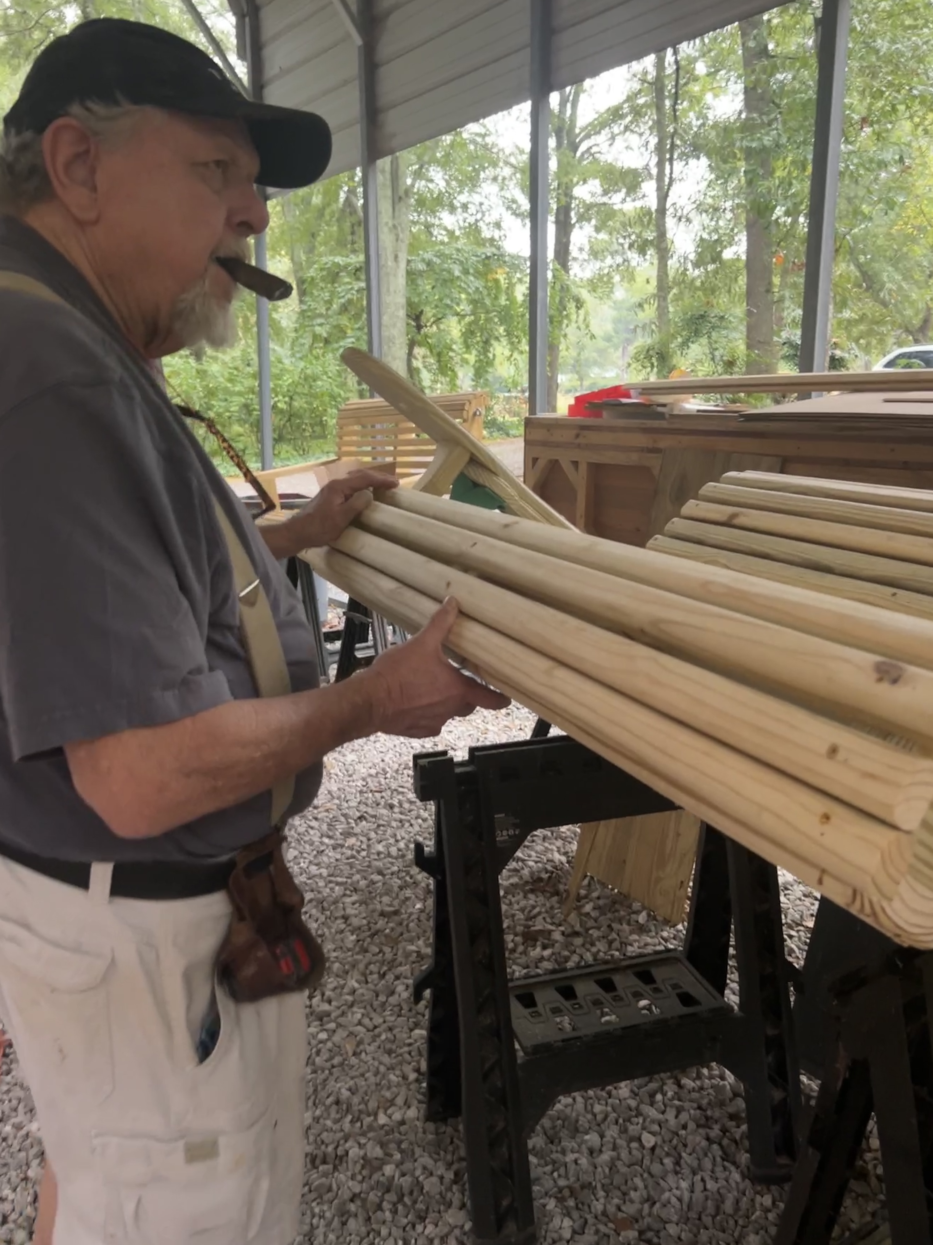Ross Dudley holds a swing that’s in progress at his Moss Creek  Swings workshop. The former Athens-Clarke County fireman said  he stays backed up with orders. (Chloe Beaver/The Oglethorpe Echo))