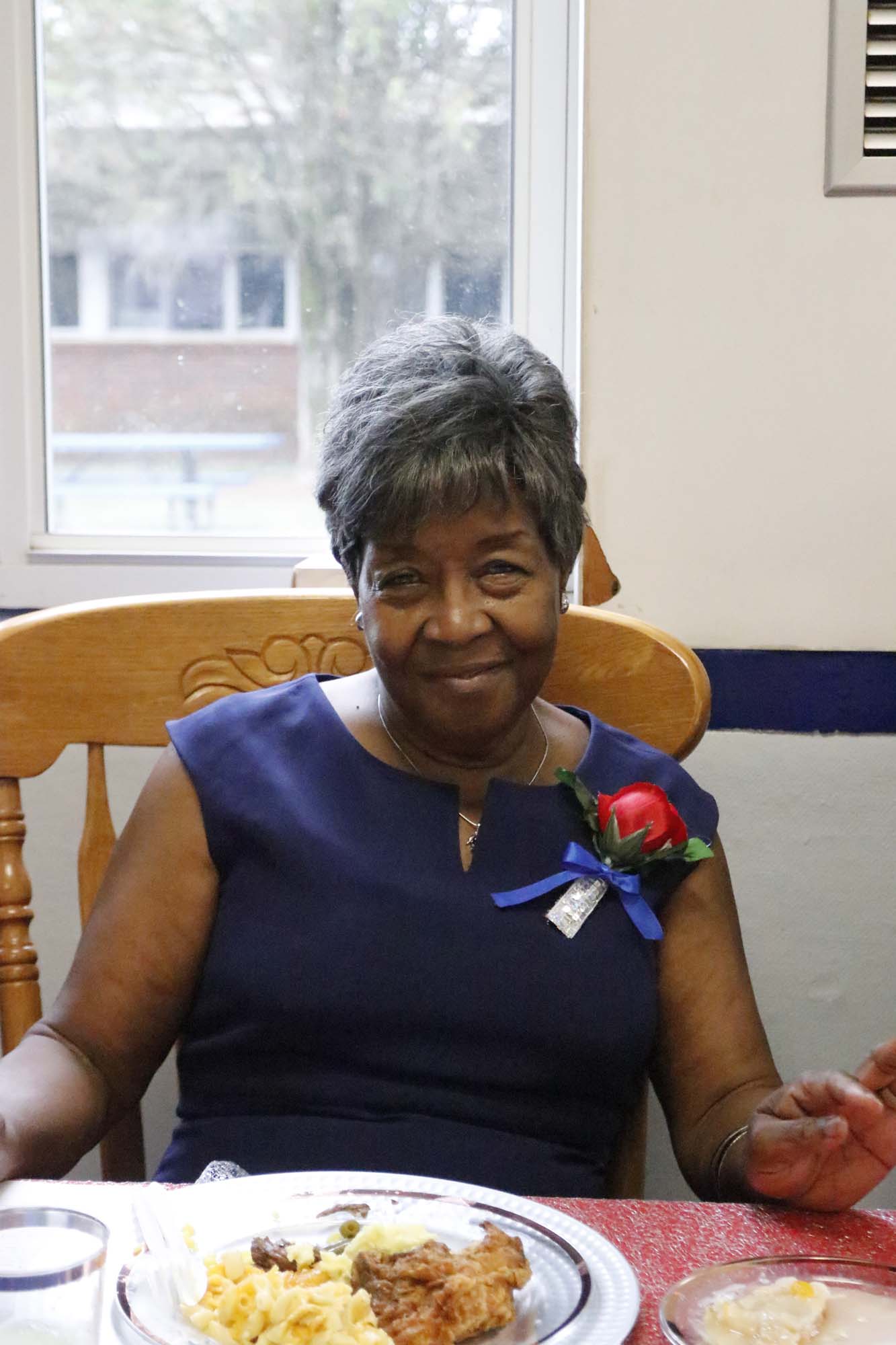 Maggie Mobley poses at the commemorative program for the Oglethorpe County Consolidated School, which is now Oglethorpe County Primary School, on Saturday, Sept. 28, 2024. Mobley was a student at OCCS, and later served as the secretary. Mobley planned the event to commemorate OCCS. (McCain Bracewell/The Oglethorpe Echo)