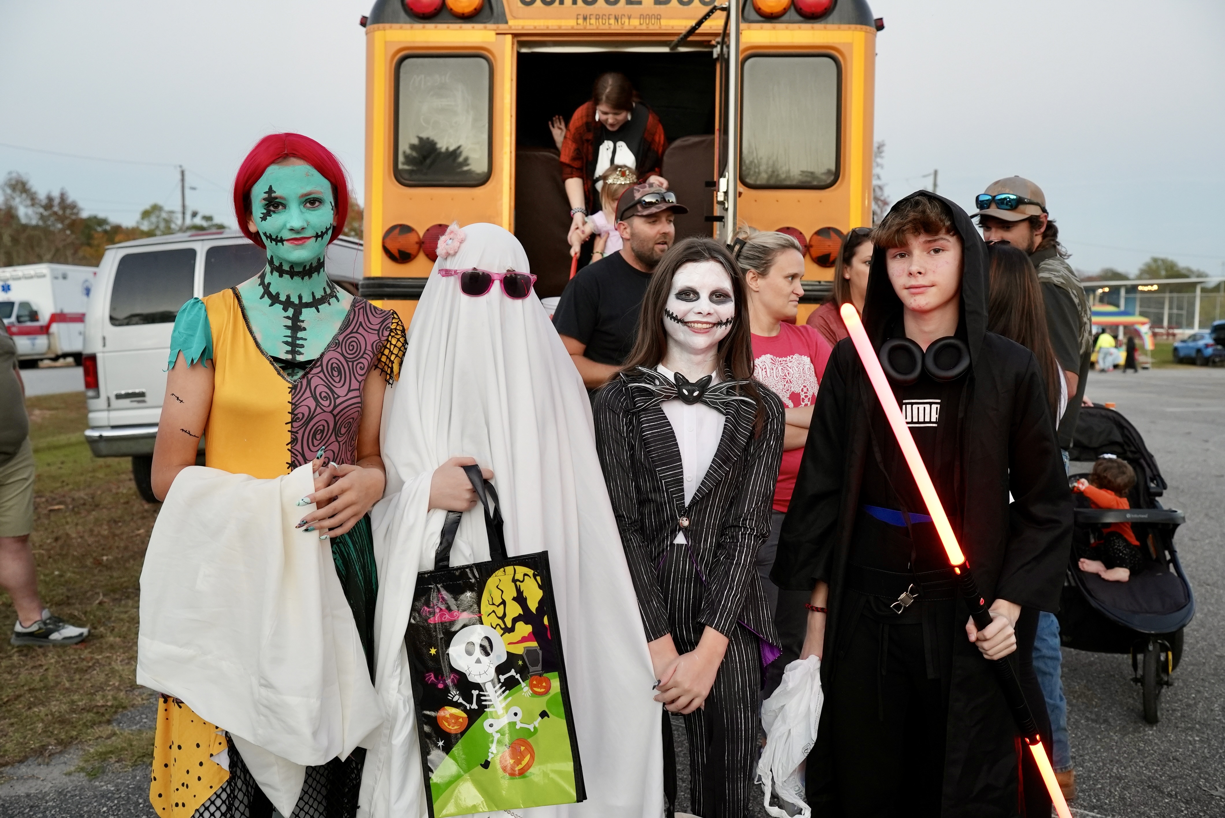 Rylee Stanley (from left), Rebecca Jones, Kinley Grimes and Julian George went all out for the rec department’s Trunk or Treat. The eighth-graders stand in front of one of the night’s biggest attractions: Ms. Frizzle’s Magic School Bus. (Saylor Williams/The Oglethorpe Echo)