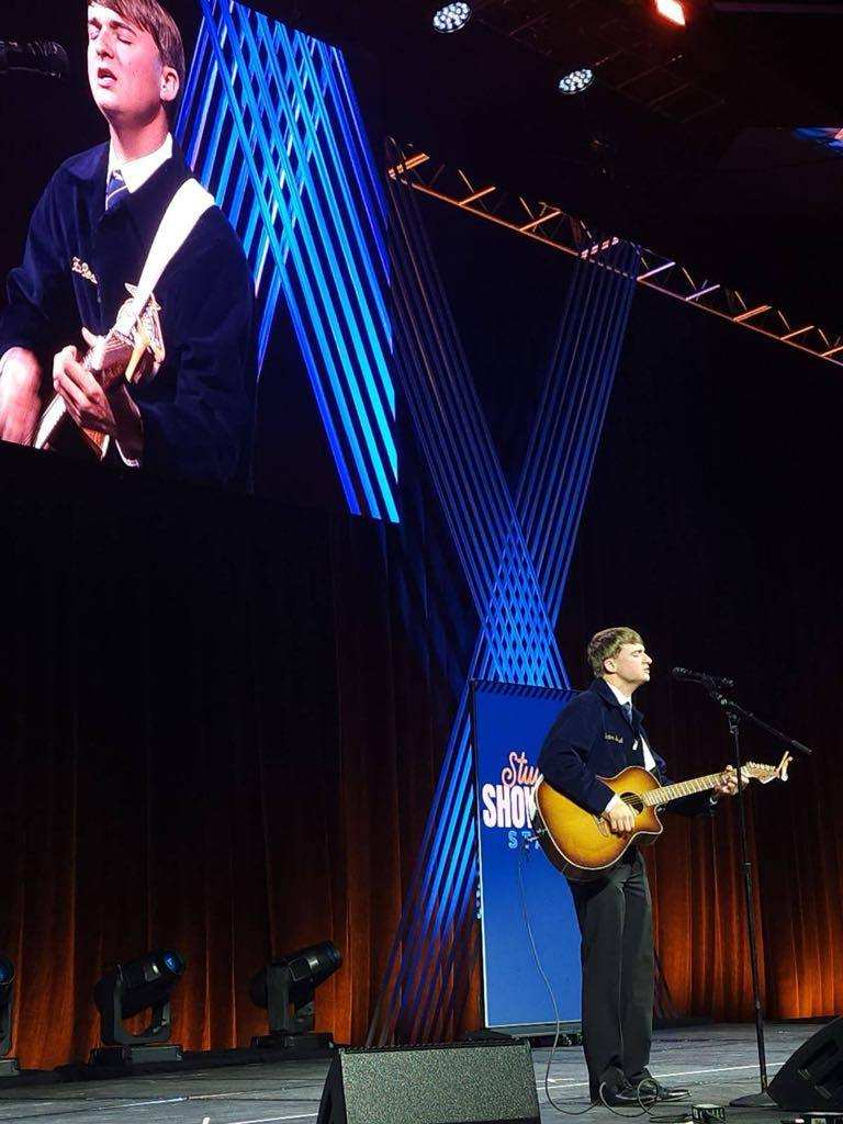 Hunter Boswell performs at the National FFA convention in Indianapolis. Boswell, who was one of 48 out of 200 chosen to perform at the convention, said this was his biggest crowd ever at 68,000 people. (McCain Bracewell/The Oglethorpe Echo)