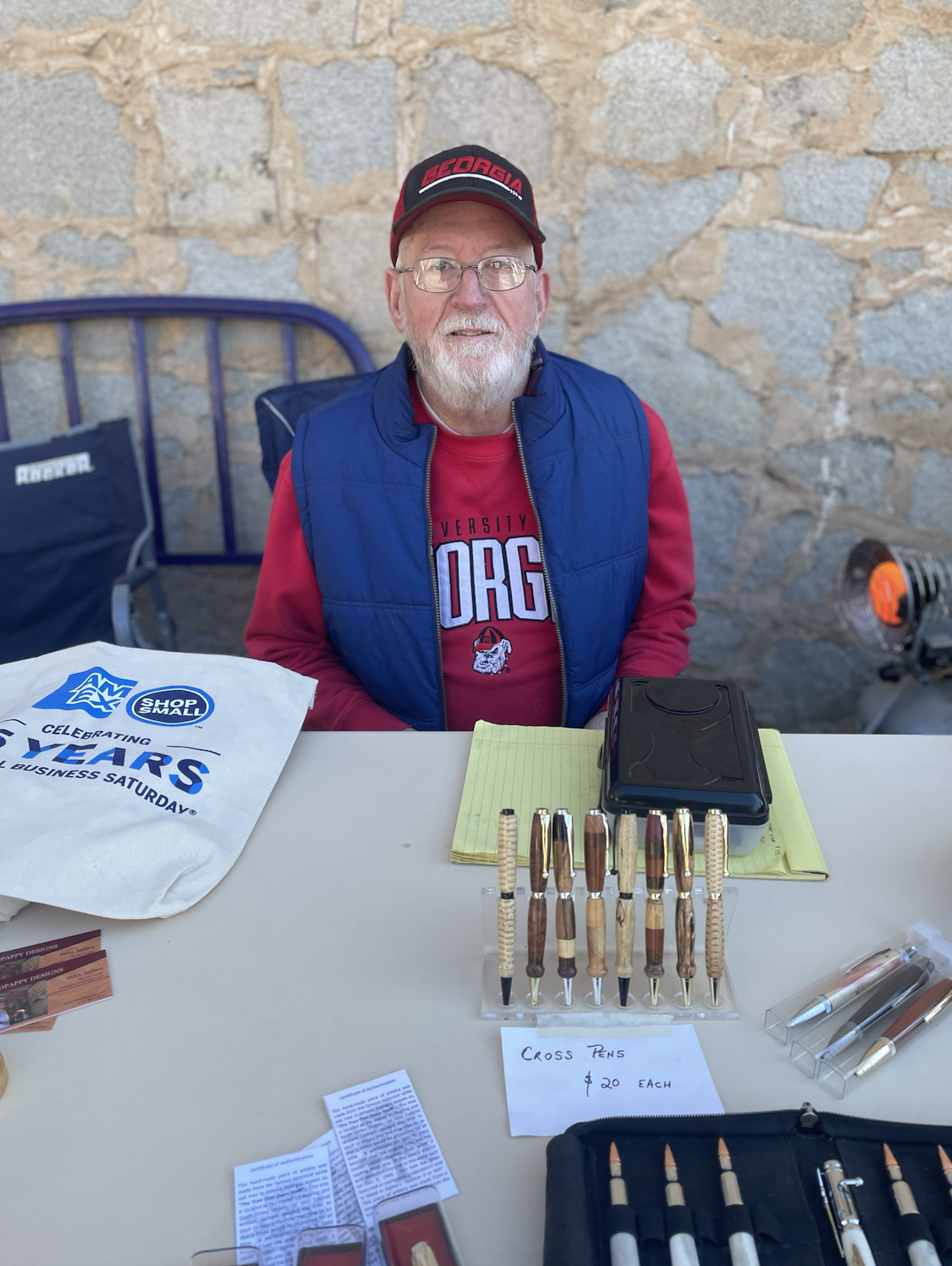Mike Sellers, the owner and creator of Woodpappy Designs, displays his handcrafted wooden creations- including bowls, pens, wine bottle stoppers, coin trays, and more- at Small Business Saturday. The event, hosted by Linda Parish, took place on Main Street in Lexington on Saturday, Nov. 30, from 10 a.m. to 3 p.m. and highlighted the work of local artisans and vendors. (Photo Credit/Chloe Beaver)
