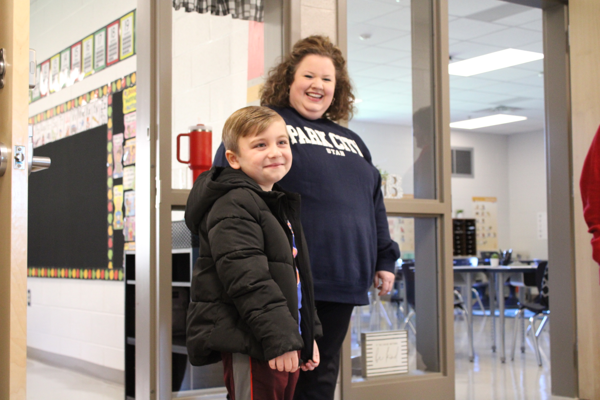 Grady Deaton, 6, and first-grade teacher Katie Cook are all smiles during the first open house at Oglethorpe County Elementary School on Tuesday. The new school is scheduled to open on Friday. (Sarah Coyne/The Oglethorpe Echo)