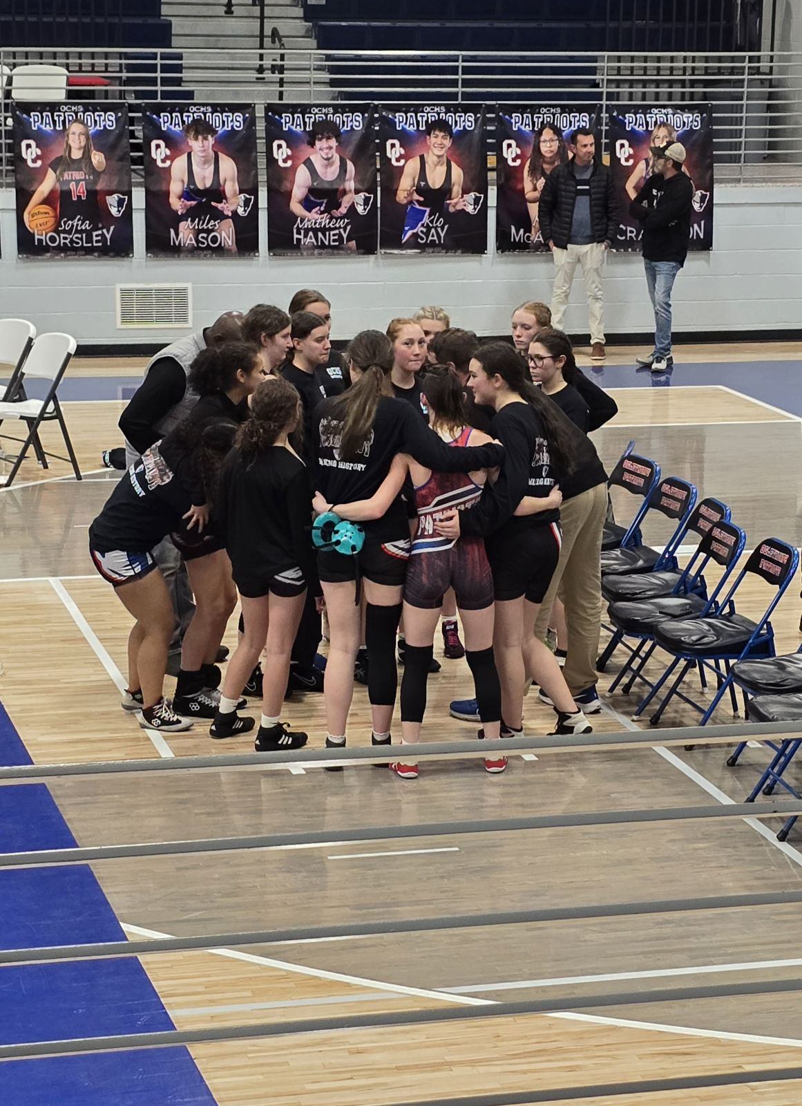 The Patriots huddle during their first-round victory over Ridgeland in the Division 2 state duals at OCHS on Dec. 18. The team heads into the individual part of the season with matches at Westside in Augusta this weekend. (Submitted Photo)
