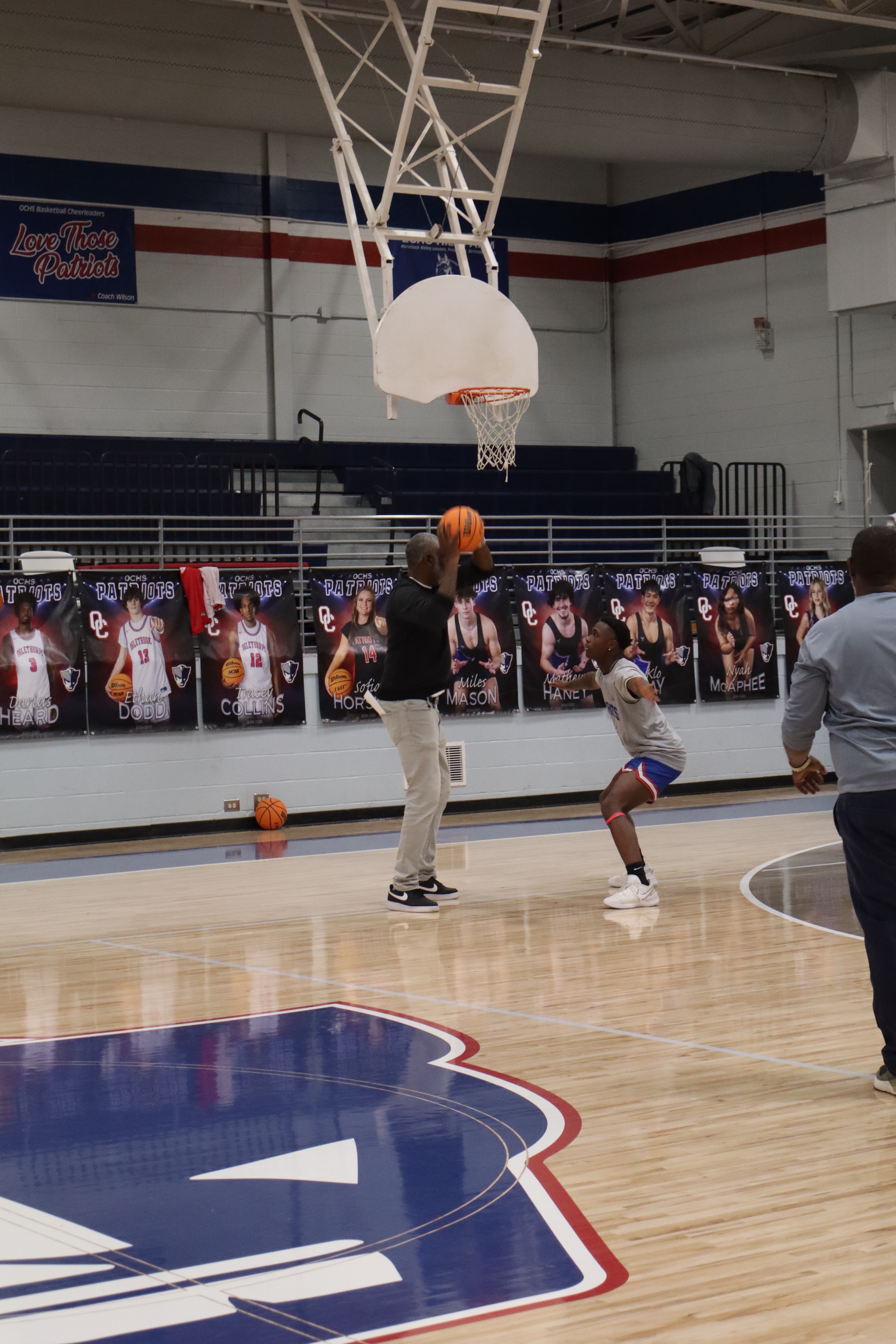 OCHS boys basketball coach Carlos Strong practices with his team, going through drills to work on the Patriots’ defense. Strong is in his first year at OCHS, which is 1-12 heading into the final four regular-season games. (Photo/ Avery Cameron)