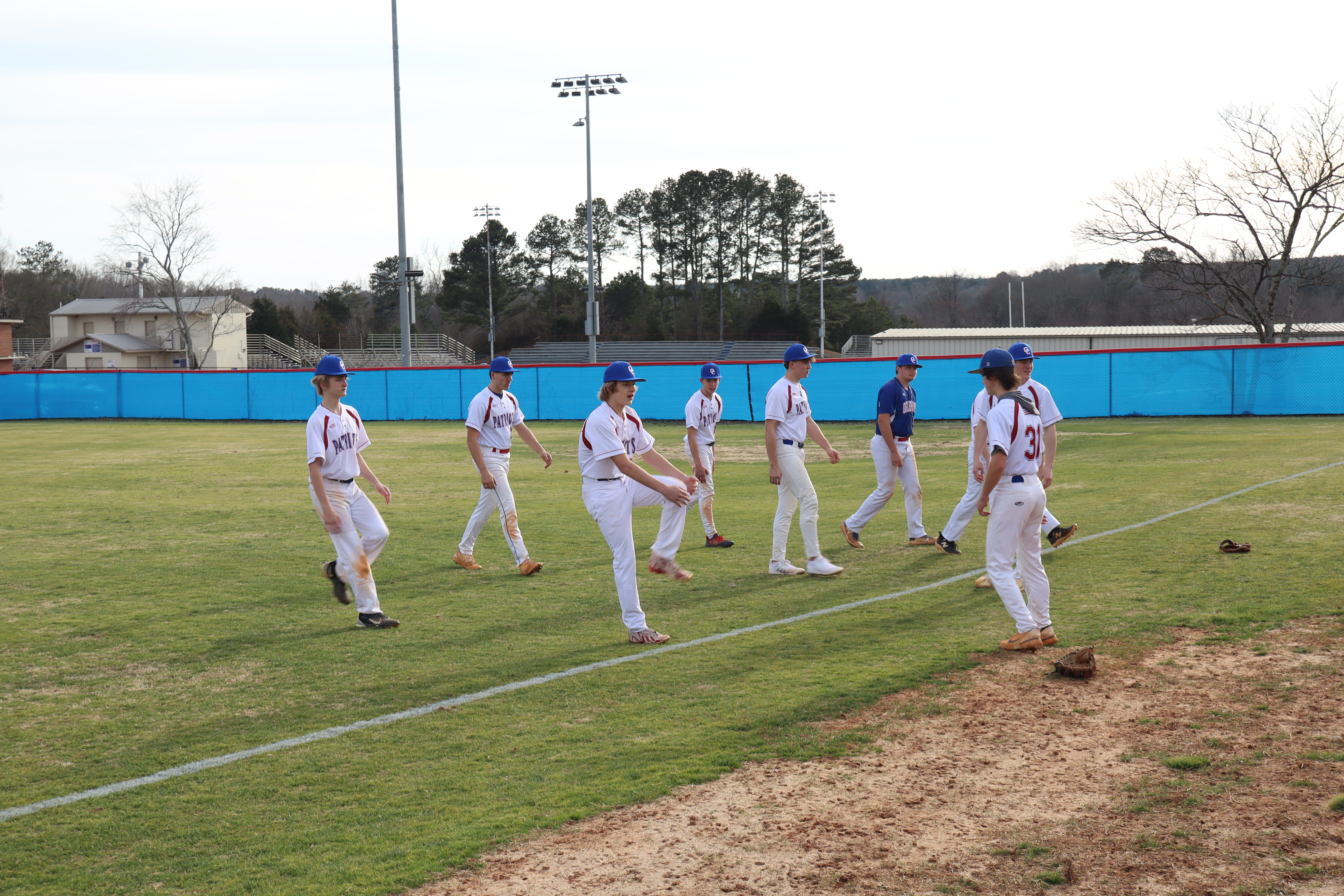 Oglethorpe County baseball players warm up during a recent practice. The Patriots will look to their pitching to lead them through Region 8-A Division I play this season. (AVERY CAMERON/THE OGLETHORPE ECHO)