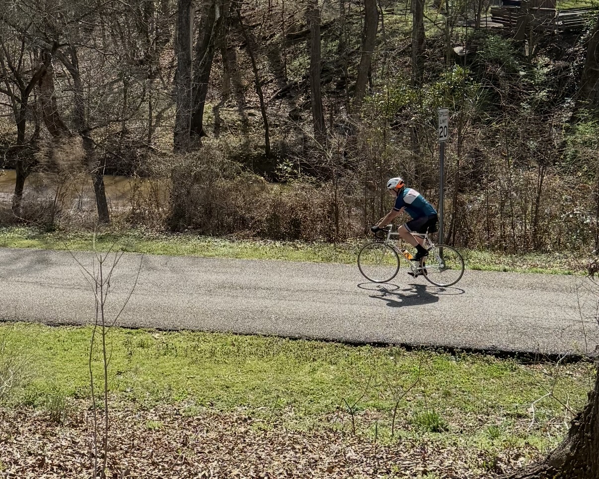 Bikers often ride along the 1.1-mile paved trail in Athens’ Dudley Park. The Athens Physical Therapy Ticket to Ride bike ride, which is scheduled for Saturday, runs through Oglethorpe County, along the route of the old railbed. (Photo/Anna Izquierdo)