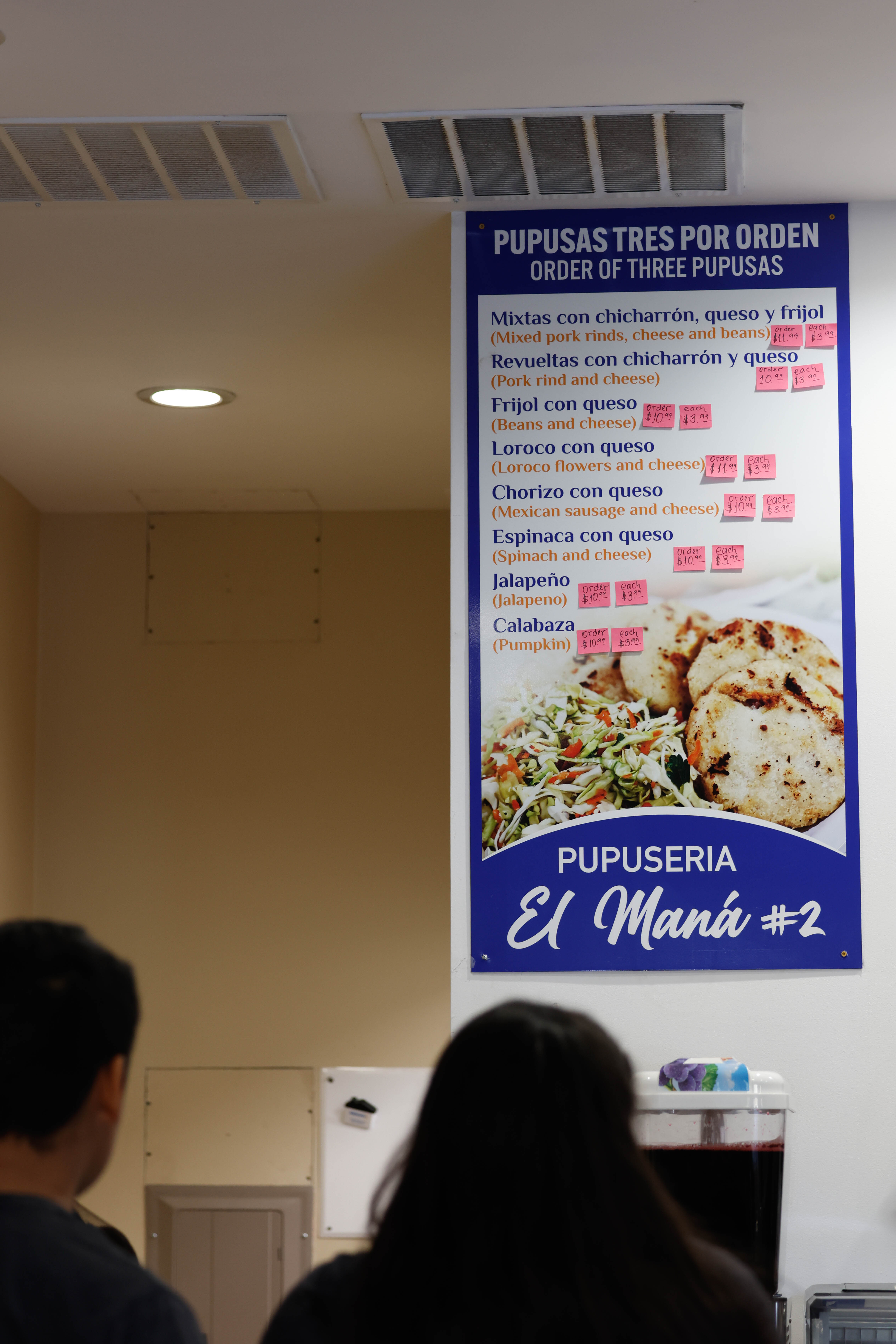 The menu at Pupuseria El Mana 2 on March 19. El Mana 2 is a new Salvadoran restaurant serving pupusas, tamales and pollo rostizado. (Photo/Libby Hobbs)