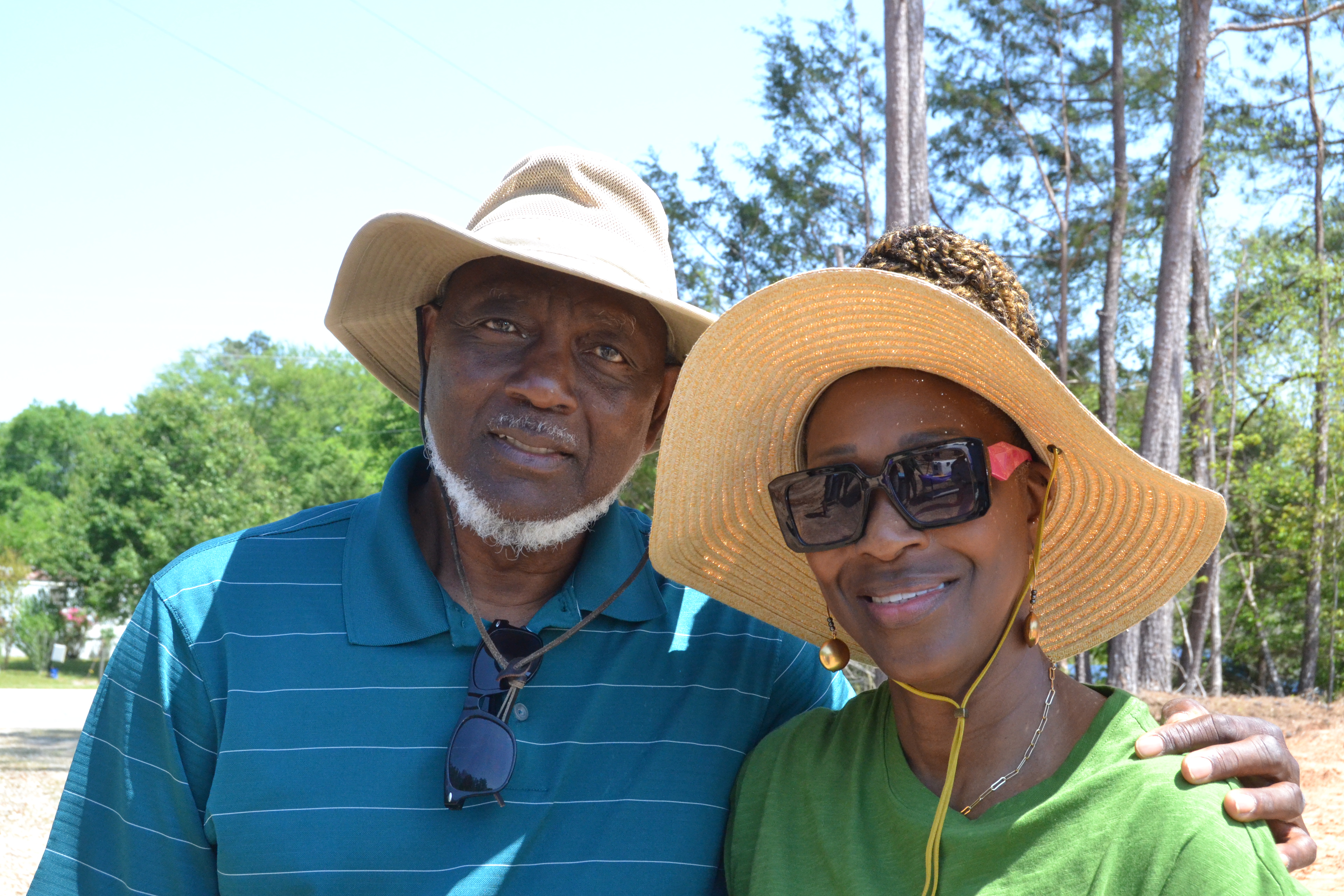 Dwight and Sheryl Howard pose in front of the Holy Ground Community Garden at its grand opening on April 18. Howard said he was inspired to create the garden after he saw a vision from God. (Photo/Adriana Cascio)