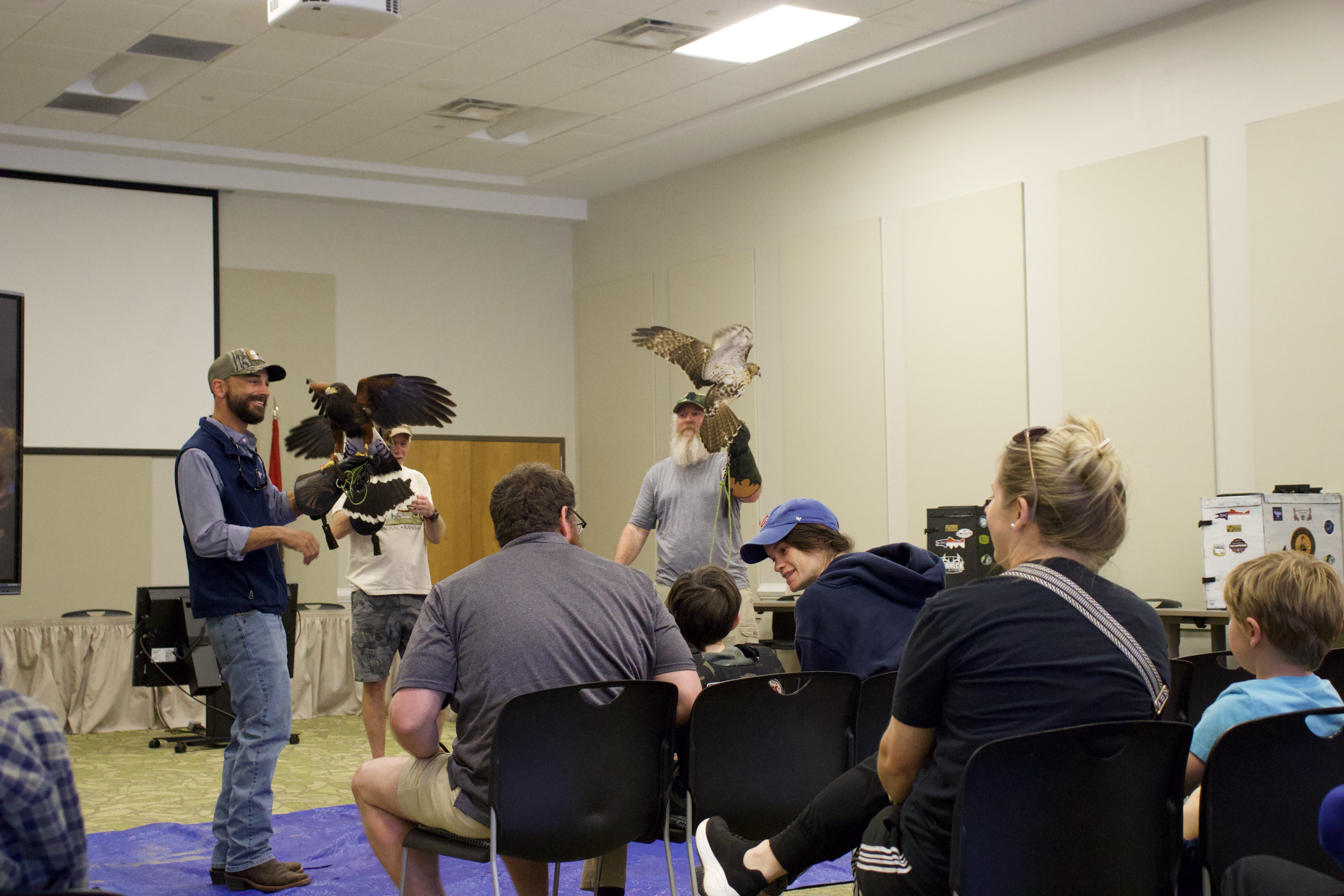 Ben Hill (from left) of the Georgia Falconry Association was joined by his sponsor Dennis Blanton and apprentice Joel Bearden at the Jefferson Public Library for a presentation on the art of falconry. Hill and Blanton showcased a sister pair of Harris’s hawks, known for their cooperative hunting, while Bearden held a red-tailed hawk.