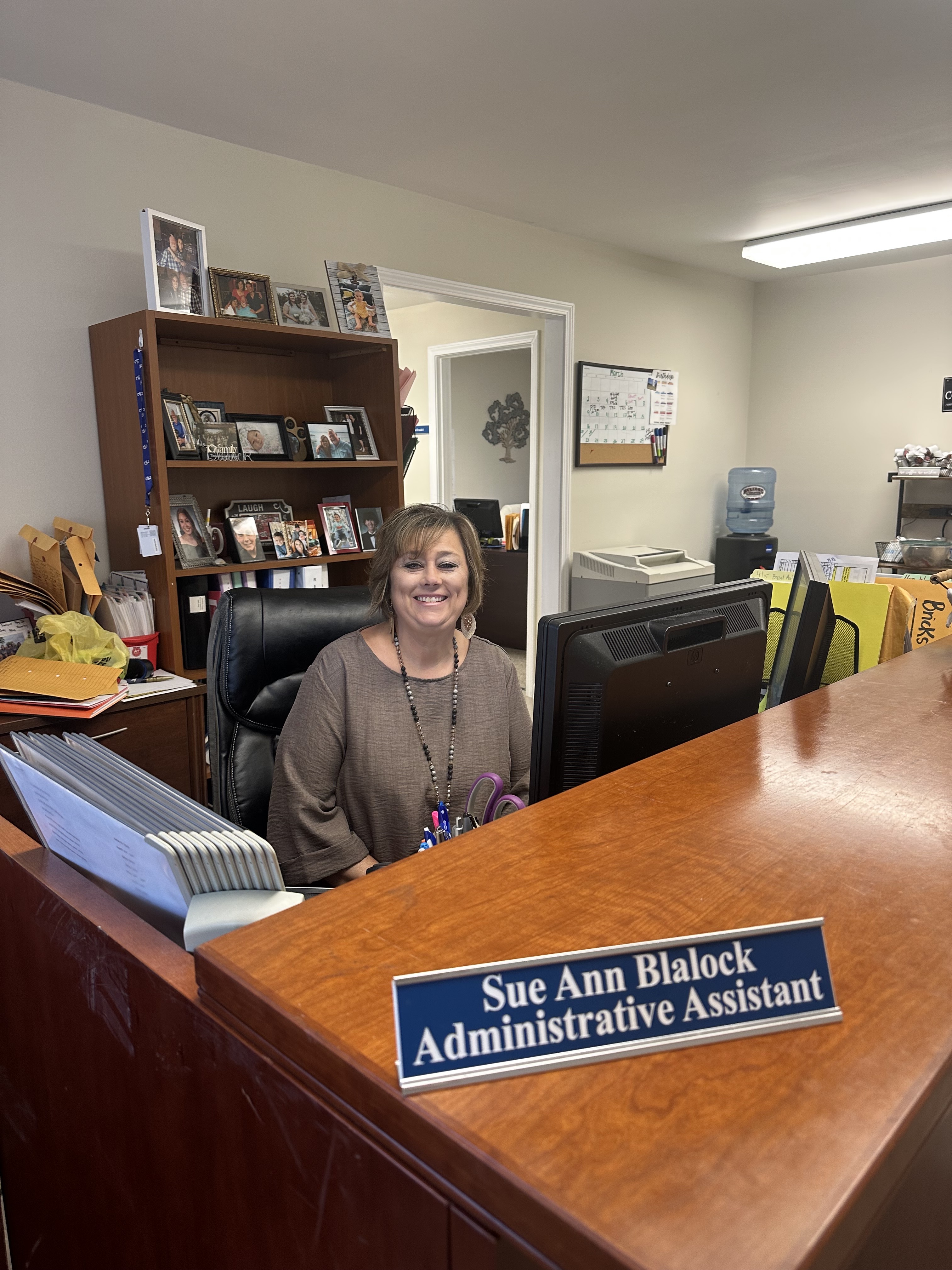 Sue Ann Blalock sits at her desk in the Oglethorpe County School System’s central office, where she works as the assistant to Superintendent Beverley Levine. Blalock has been with the school system for 26 years. (Photo/Paige Clarke)