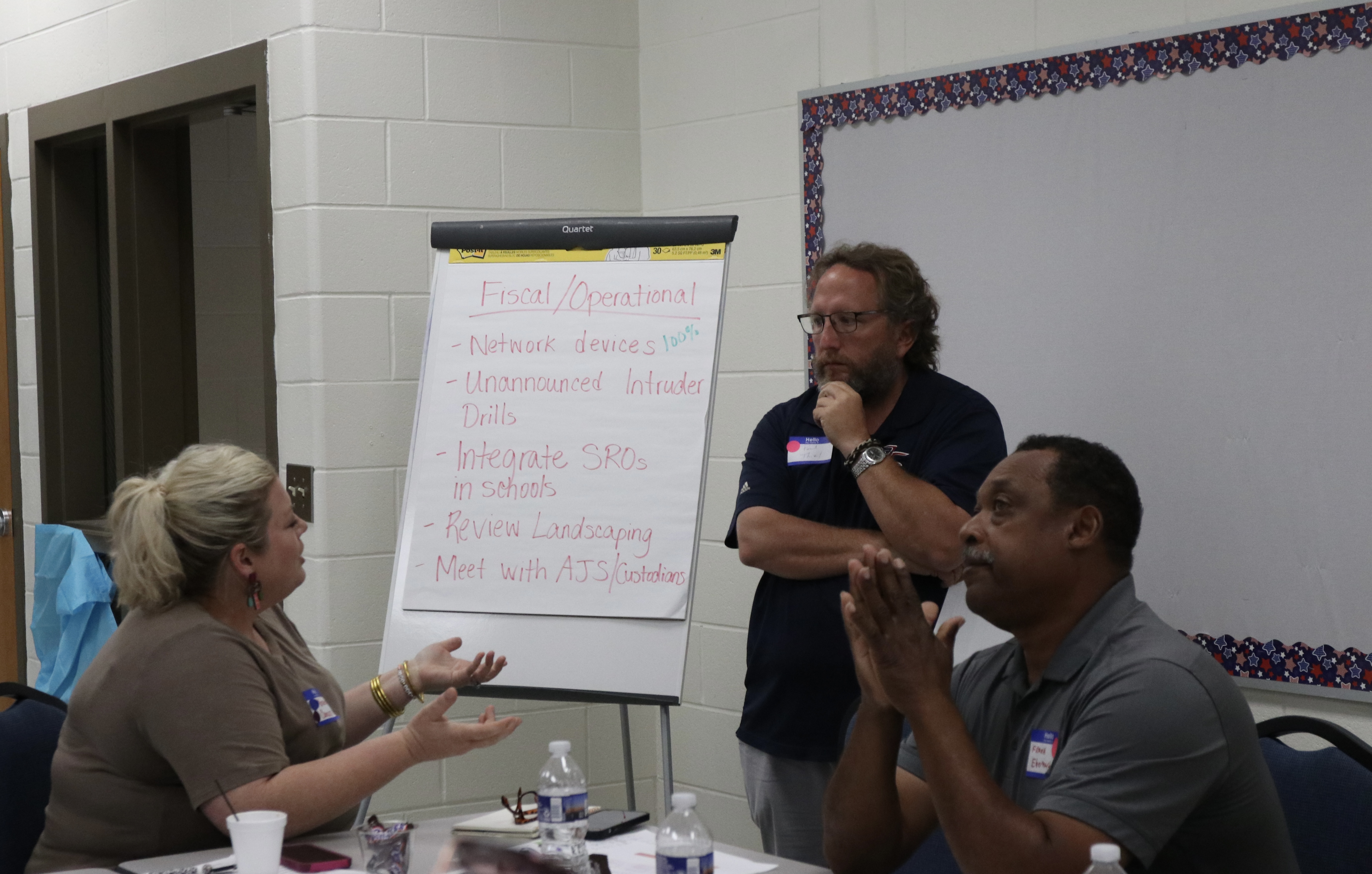 Marianne Camacho (from left), Paul Thiel and Frank Eberhart discuss fiscal and operational responsibilities during the Oglethorpe County School System’s strategic planning meeting on Tuesday at OCMS. (Photo/Anna Izquierdo)