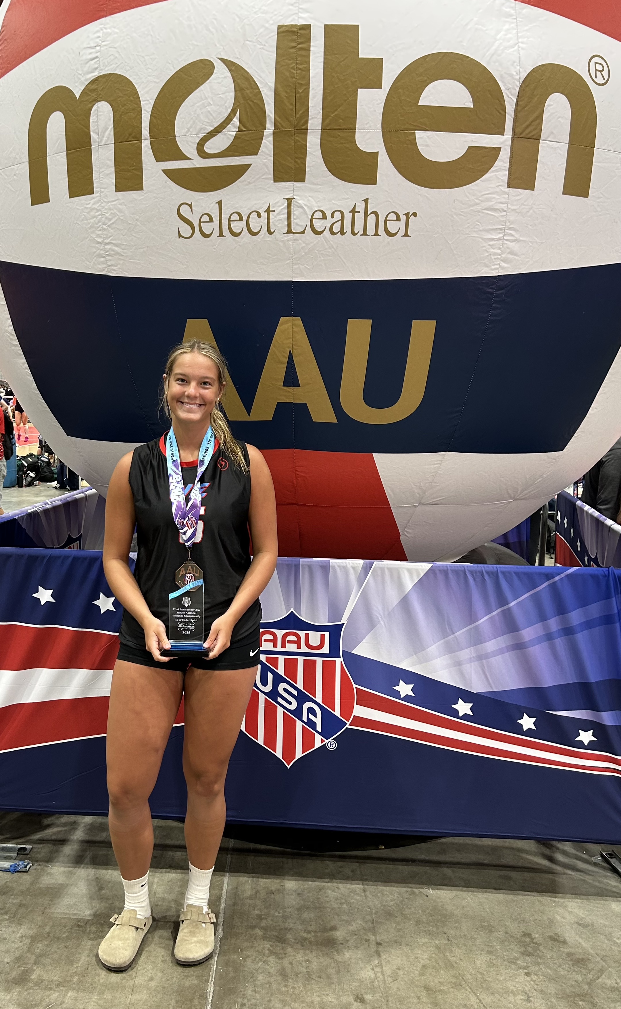 Elizabeth Cook holds a trophy for being named All-American after leading the Walton Elite Volleyball Club to a third-place finish at the AAU Girls National Volleyball Championships last month. Cook will be a senior at OCHS this fall. (Submitted Photo)