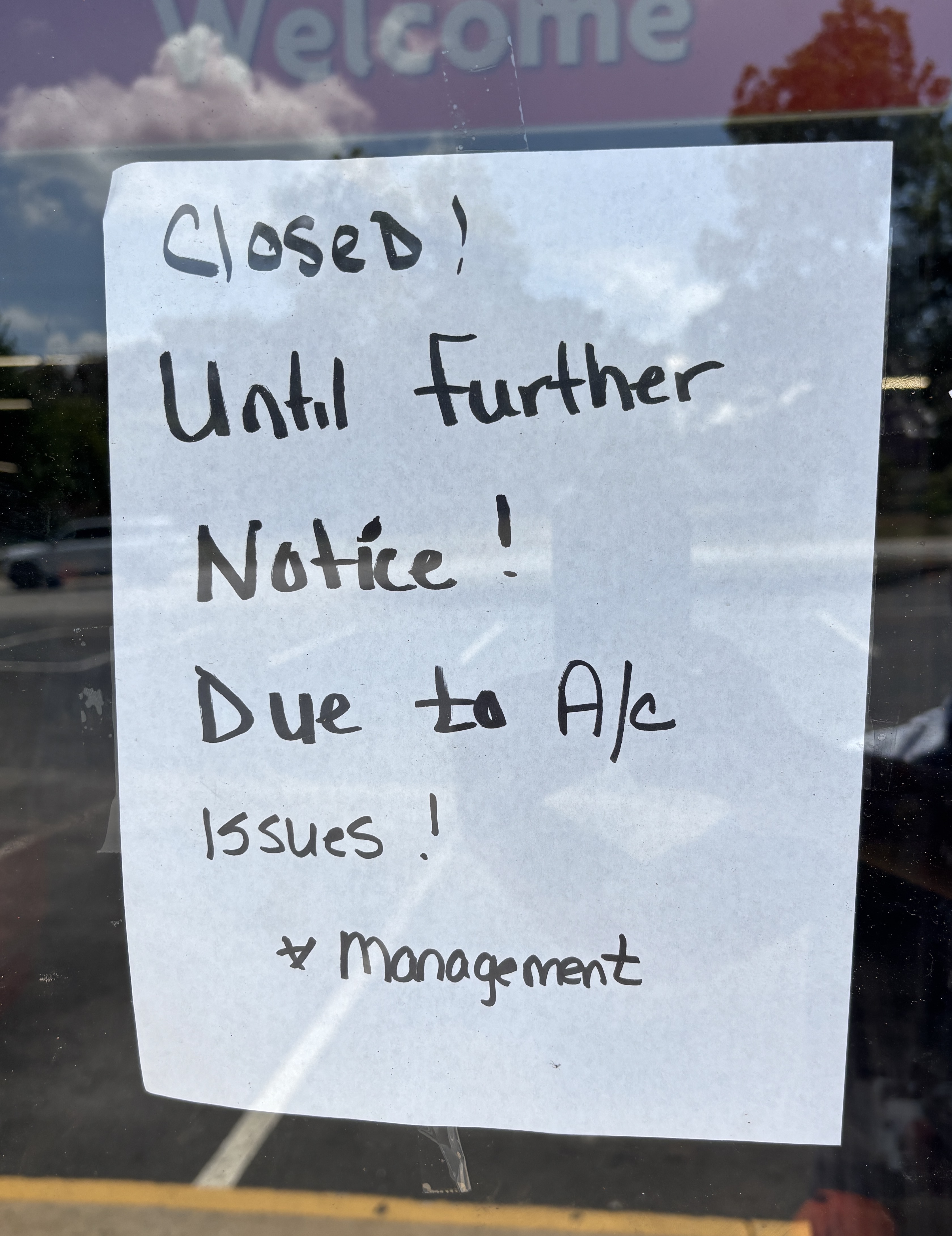Signs posted on the door of the Family Dollar in Crawford state that air conditioning problems caused its temporary closure. It’s not known when it will reopen. (Photo/Andy Johnston)