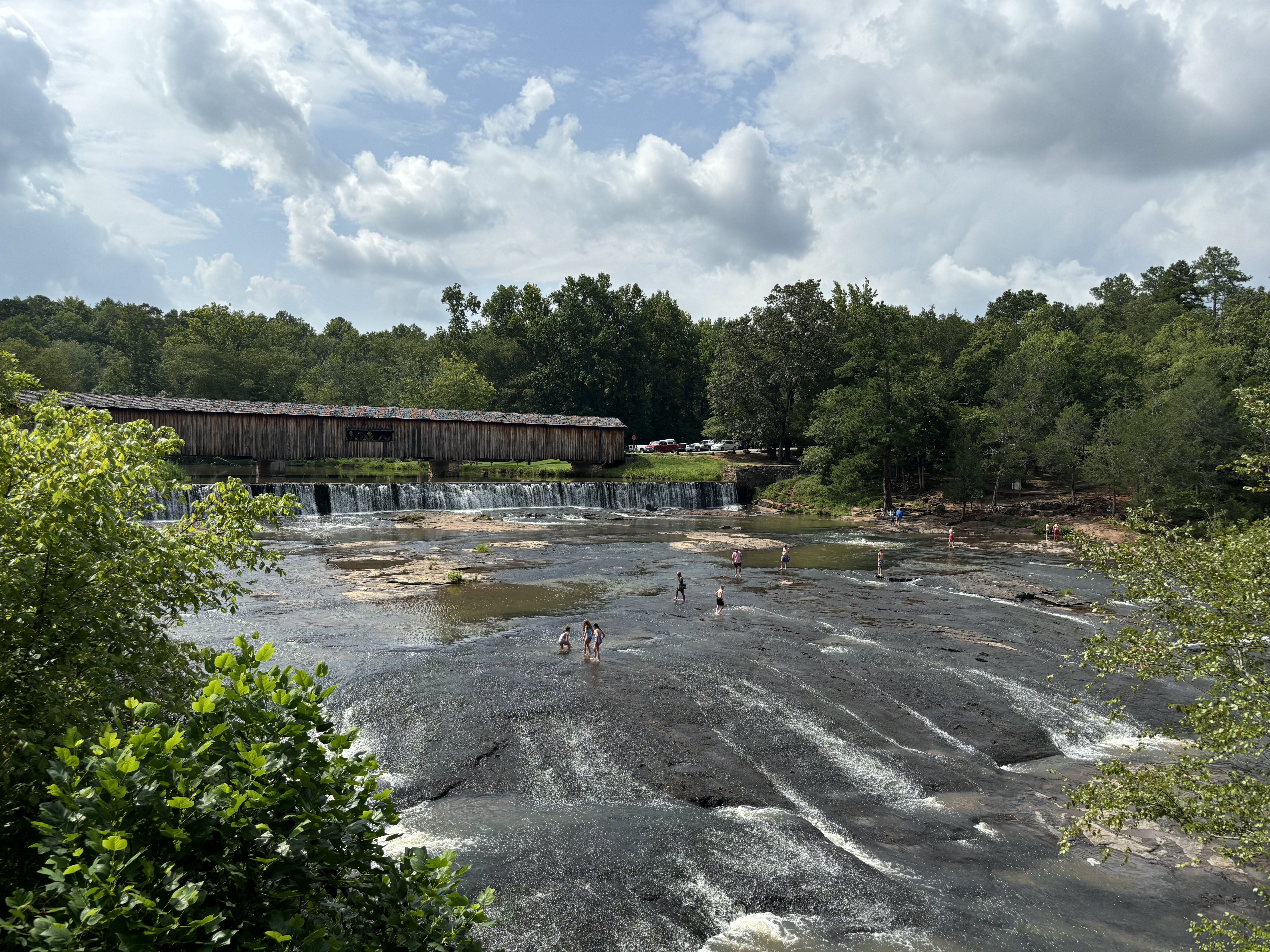 Swimming and sliding down rocks in the South Fork of the Broad River is a popular way to spend hot summer days at Watson Mill Bridge State Park. Environmental groups are working to protect the water quality there. (Photo/Jack Keys)