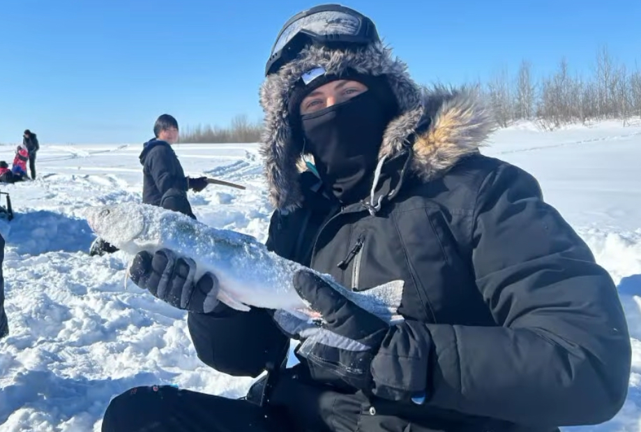 Ty Graham poses with a fish caught during the Napaaqtugmiut School’s annual ice fishing trip. He’s preparing to teach in Alaska for the third consecutive year. (Submitted Photo)