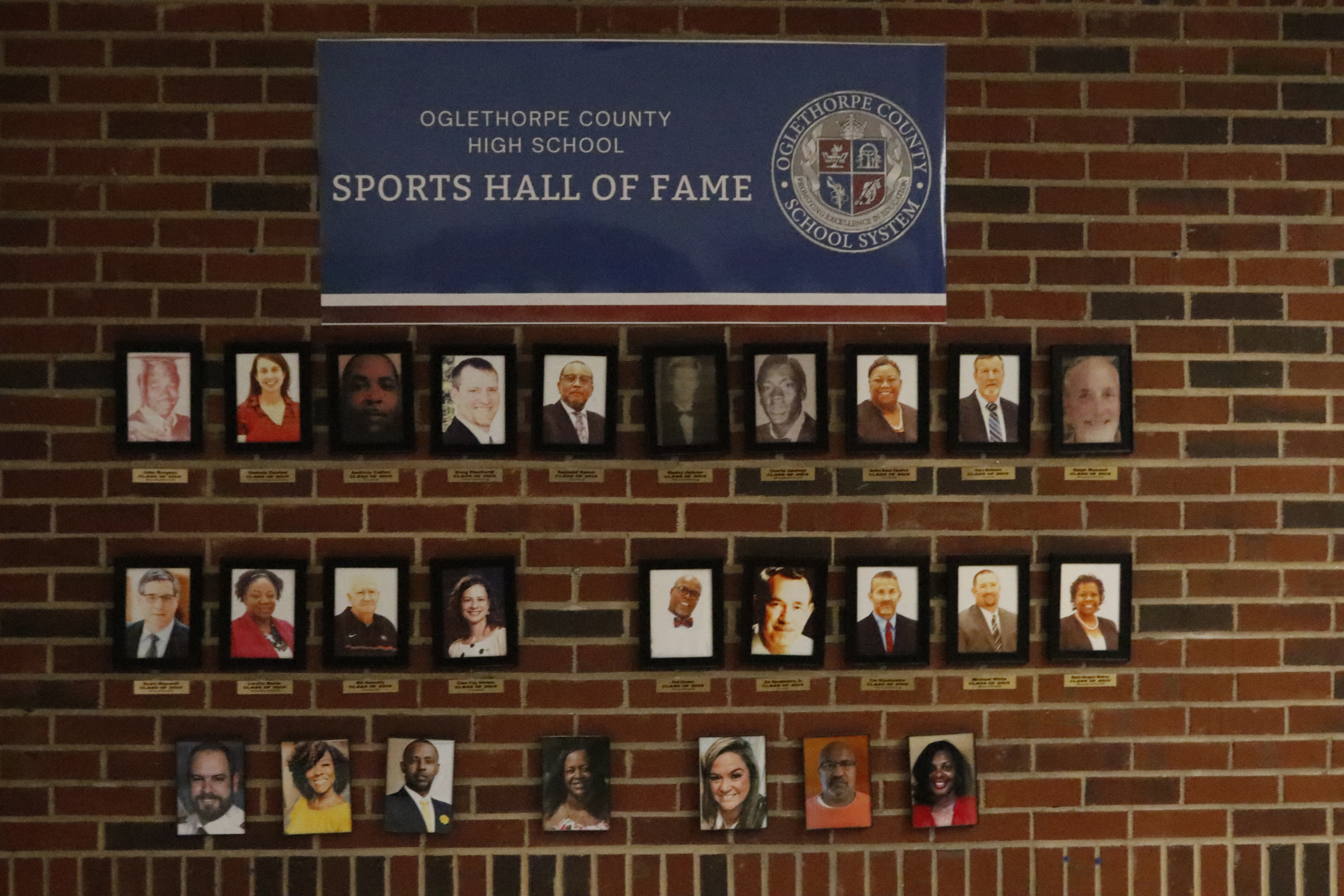 Photos of the members of the OCHS Sports Hall of Fame adorn the wall outside the main office at the school. The hall isn’t accepting applications this year after inducting eight people in 2024. (Photo/Torin Smith)