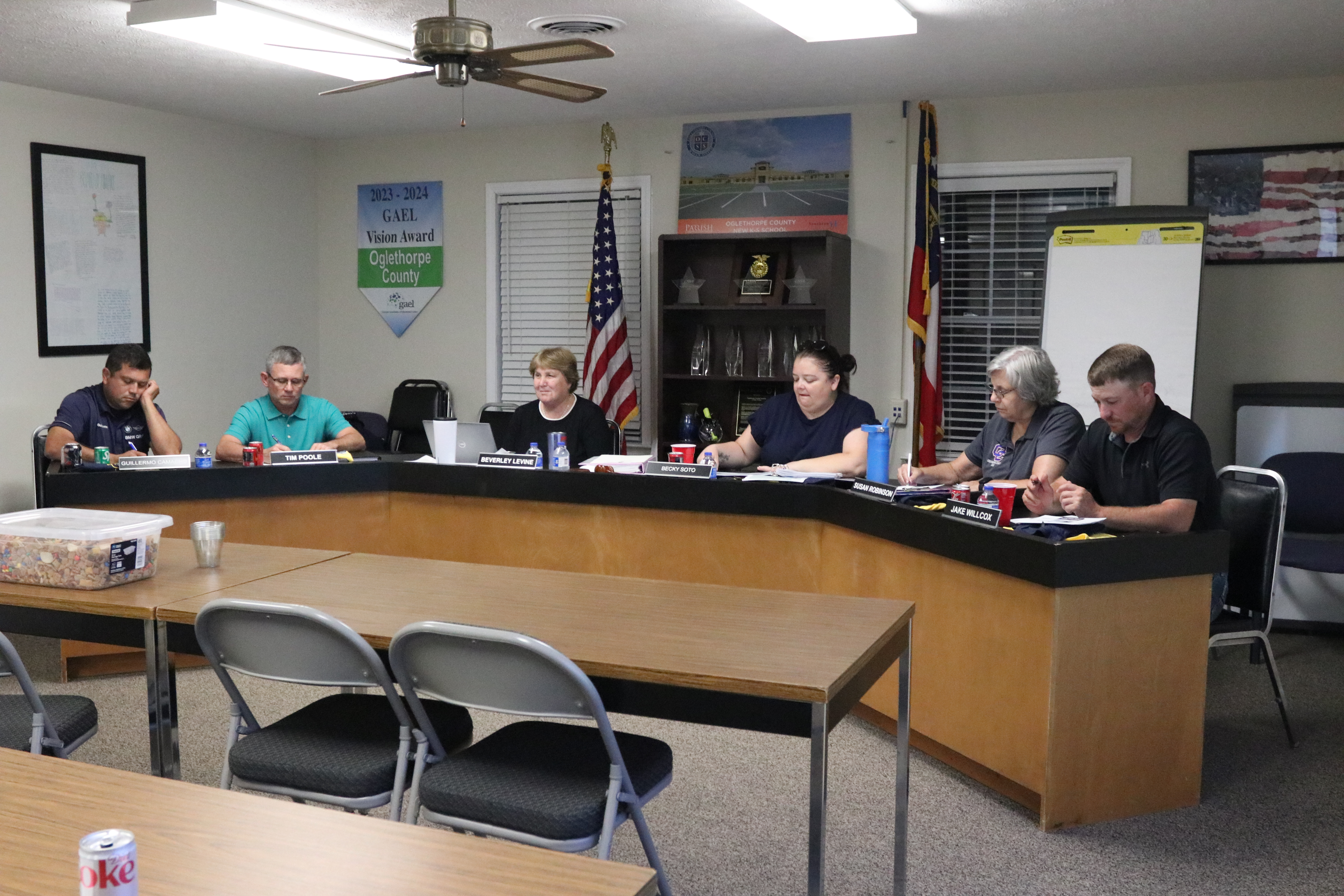Guillermo Camacho, vice-chair Tim Poole, superintendent Beverley Levine, BOE chair Becky Soto, Susan Robinson and Jake Willcox discuss items during the Aug. 12 Board of Education meeting. (Photo/Anna Izquierdo)