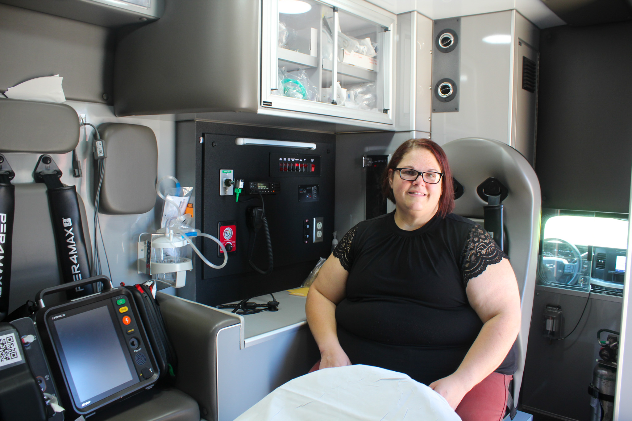 Kristin Gilliam sits inside an Oglethorpe County EMS truck on Thursday, Sept. 11, in Crawford, Georgia. Emergency medicine is her passion, and she loves being on the front lines helping her community. (Photo/Gabrielle Gruszynski)
