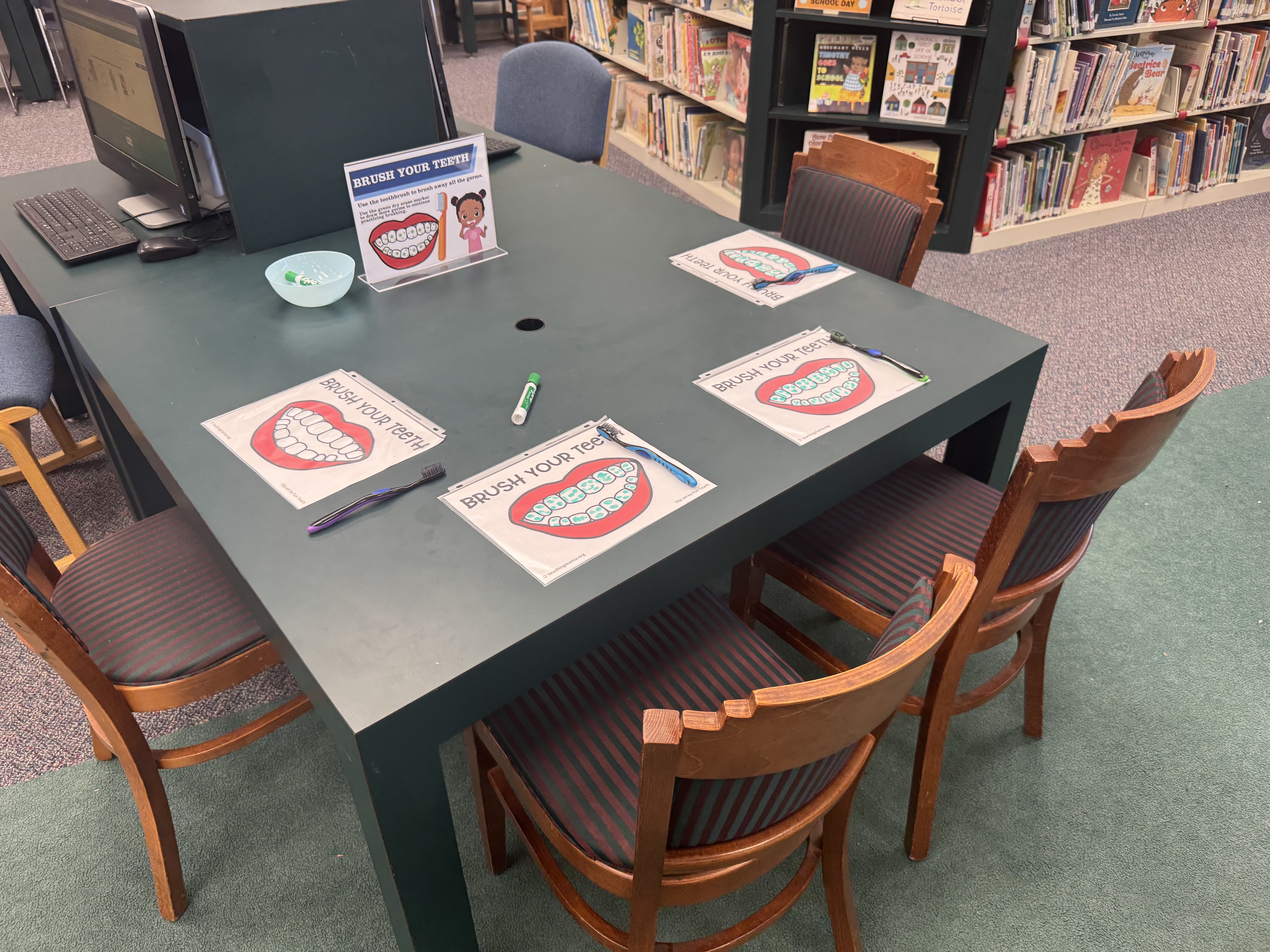 Children learned about dental hygiene at the Oglethorpe County Library Family Health Resource Fair on Saturday, Aug. 30, 2025. Using a toothbrush and a dry-erase marker, participants cleaned drawings of teeth as a visual lesson in proper care. (Photo/Maura Rutledge)