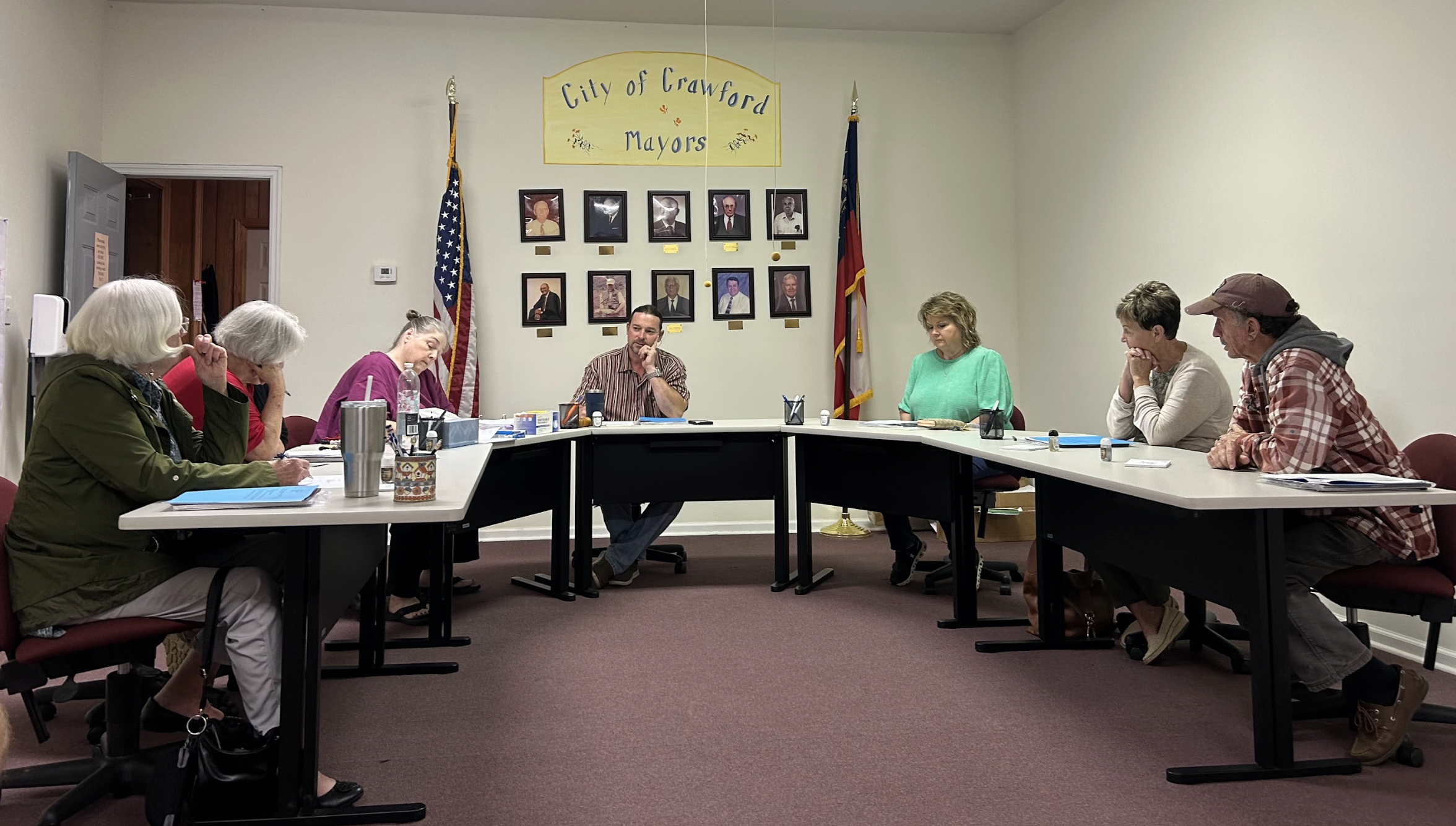 The Crawford City Council Sandra Sheridan (from left), Brenda Butler, city clerk Amy Wall-Lance, Mayor Seavy O’Neal, Kathy Little, Carol McGrath and Johnny Shedd met on Nov. 12 , 2024 for its monthly meeting. Sheridan stepped down last month after serving on the council for nearly 15 years. (Photo/ Sarah Coyne)