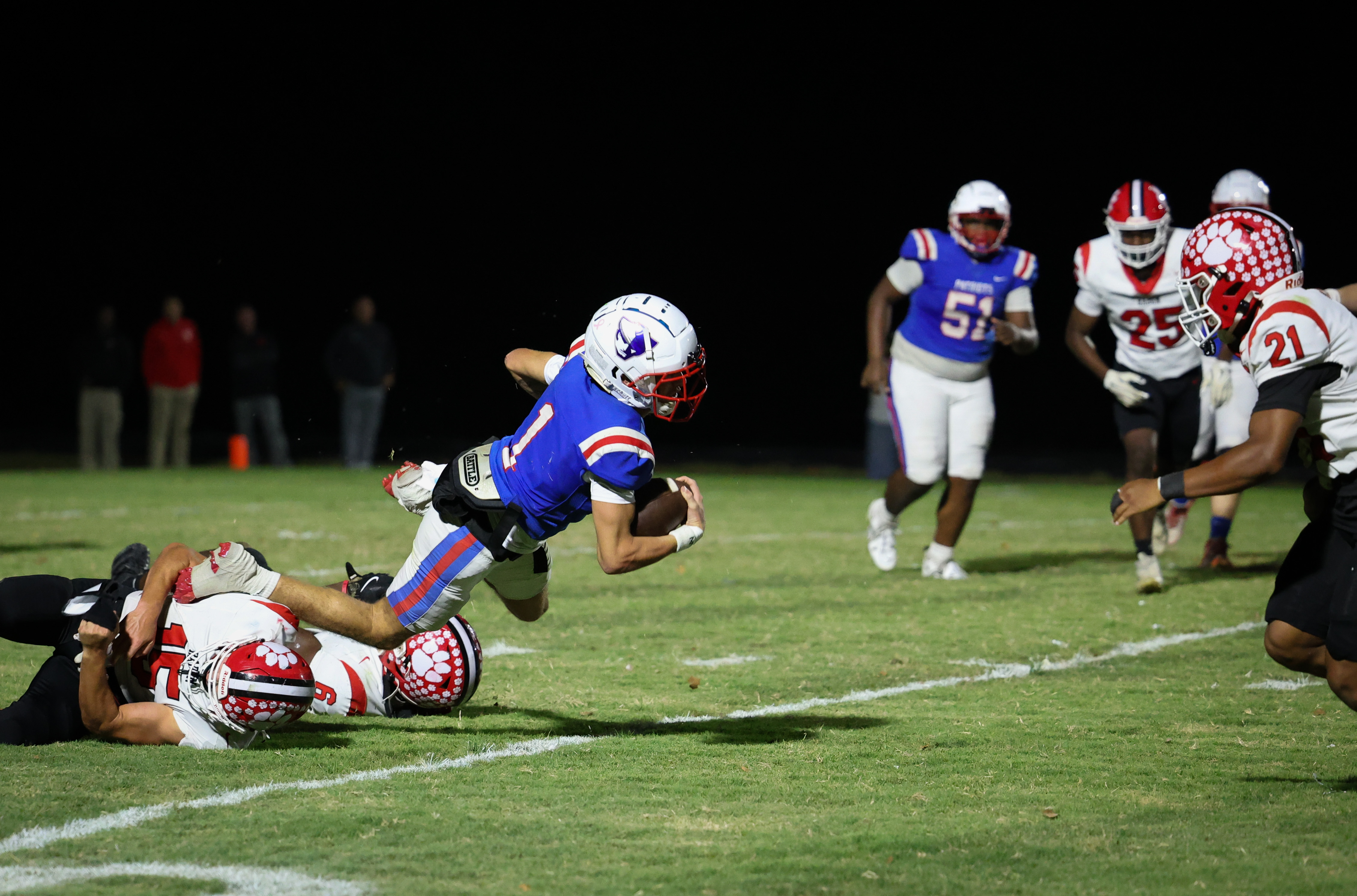 Oglethorpe County quarterback Caden Hartrum tries to elude Rabun County’s Reid Giles (15) in the Patriots’ 28-19 upset of the fifth-ranked Wildcats on Friday night. Hartrum threw two touchdown passes and ran for another in the Patriots’ first region win of the season (Ashleigh Johnston/The Oglethorpe Echo).