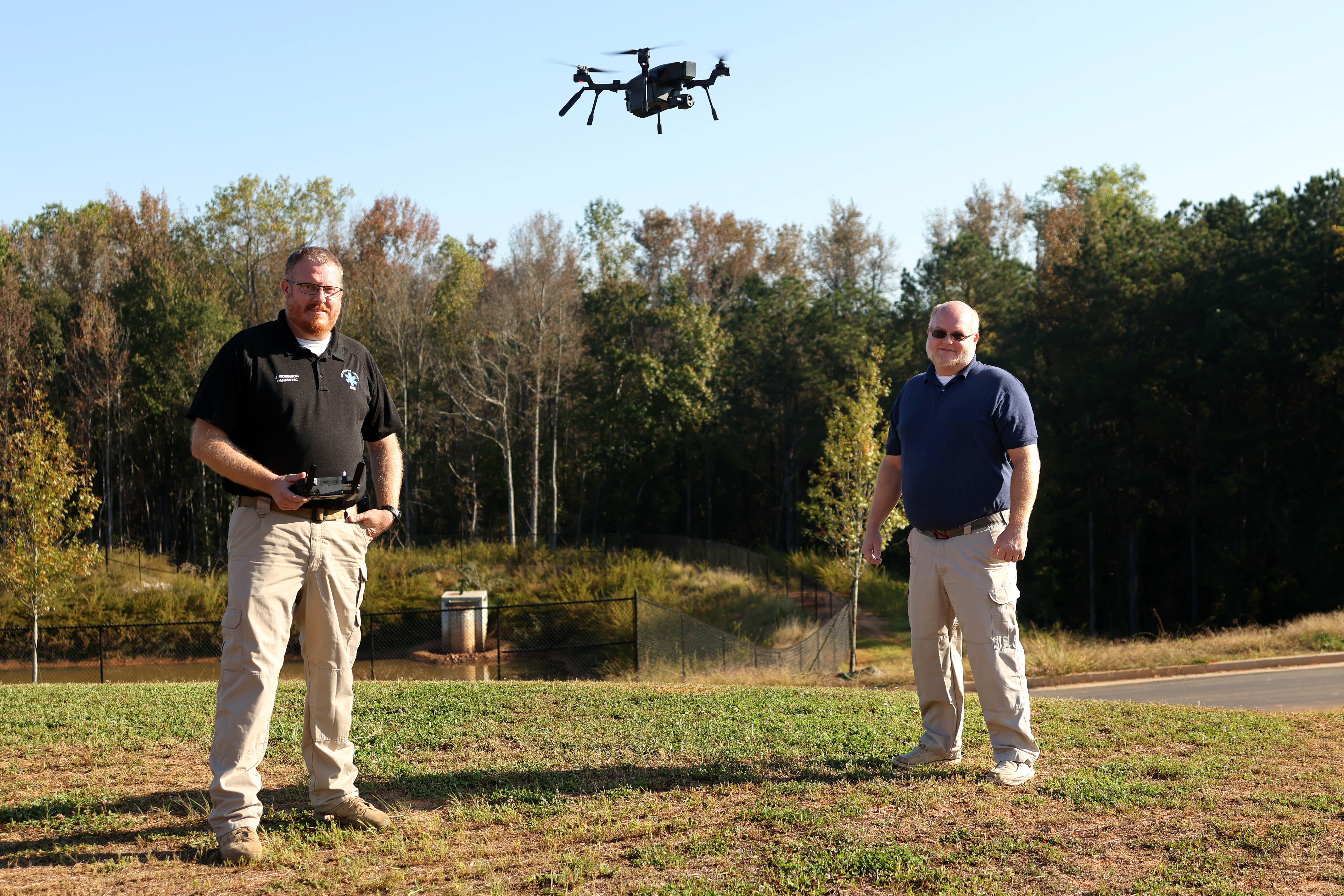 Oglethorpe County EMS director Josh Robinson (left) and Emergency Management Agency director Douglas Spencer send the Teledyne FLIR SIRAS drone up for a flight in Lexington last week. They are the county’s two licensed drone pilots. (Katherine Davis/The Oglethorpe Echo)