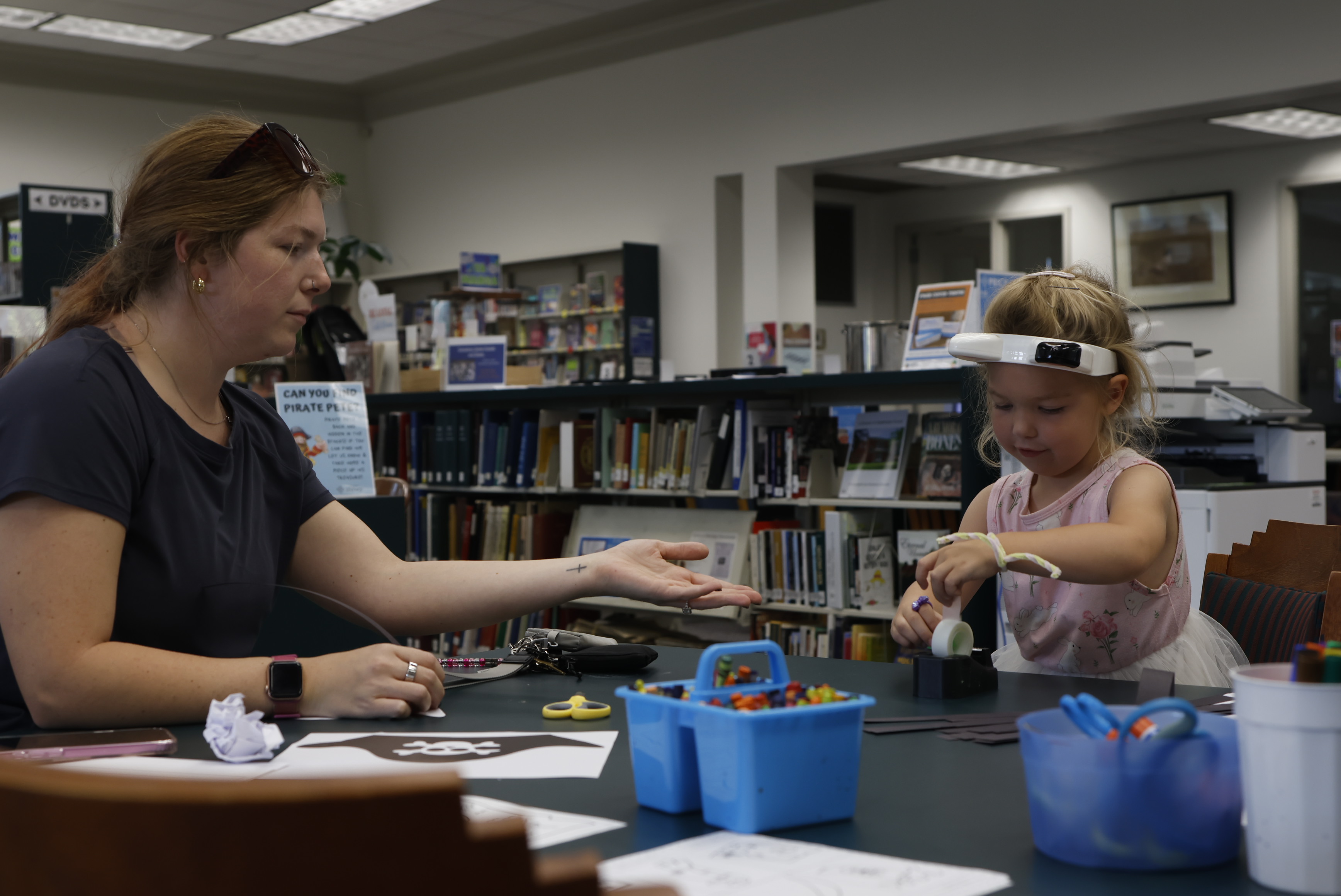 Crawford resident Erica Lillard helps her daughter, Clementine, make a pirate hat during Homeschool Hangout at the Oglethorpe County Library on Friday, Sept. 19, 2025. (Photo / Drew Bearden)
