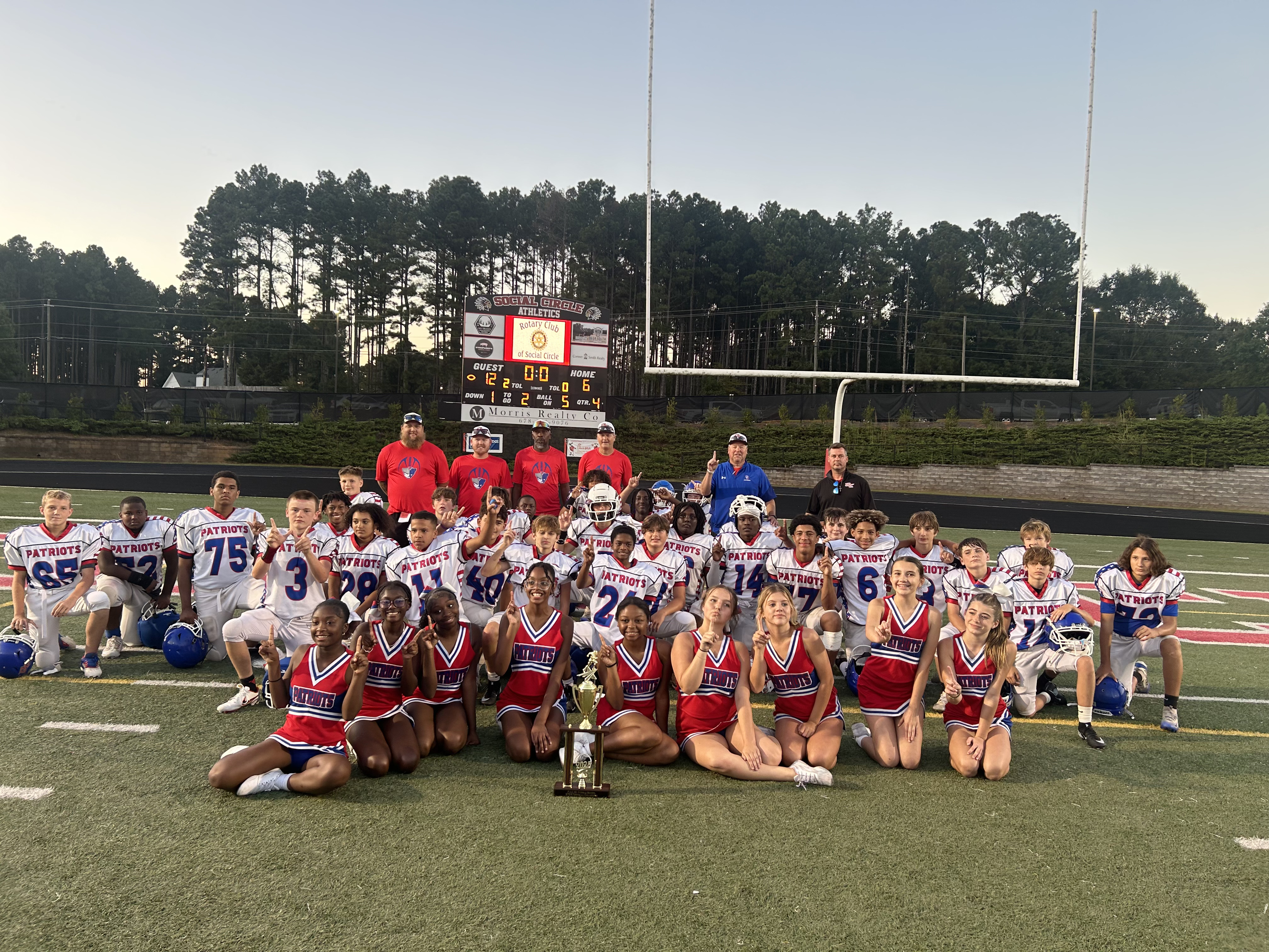 Oglethorpe County Middle School players and cheerleaders celebrate after defeating Social Circle 12–6 to win the PAC-11 championship last week. The Patriots didn’t allow more than six points in any of the final four games.