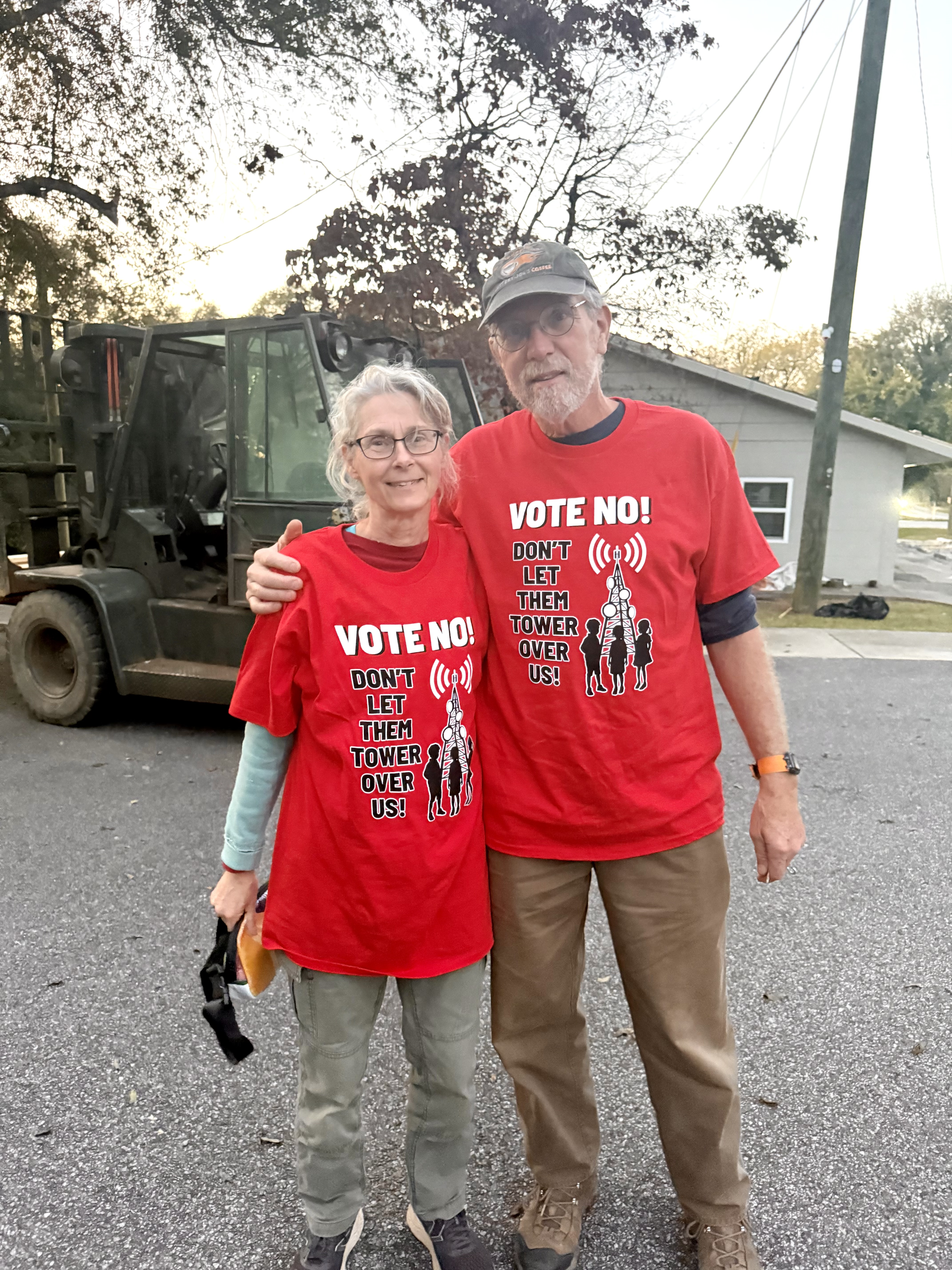 Linda Russell and Bob Gadd are among the residents who oppose the construction of a T-Mobile cell tower off Melton Road. Many of the attendees at the zoning board meeting on Oct. 23 wore red shirts with the phrase: “Vote no! Don’t let them tower over us!”