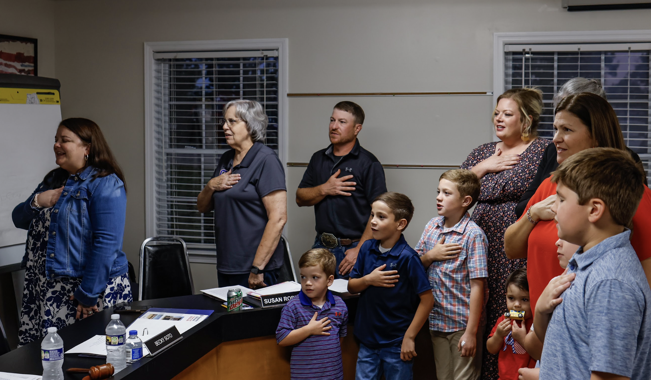 Oglethorpe County Board of Education members, teachers of the year and their families lead the pledge to kick off the BOE on Tuesday. The BOE approved a new millage rate. (Photo/Drew Bearden)