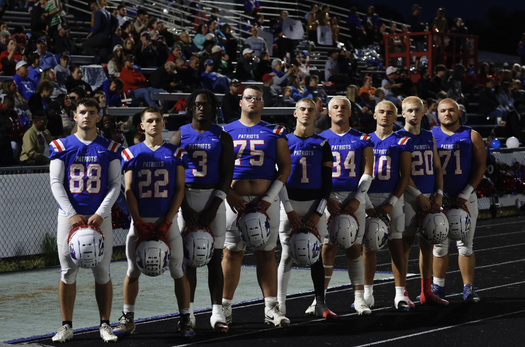Oglethorpe County’s seniors include Braxton Edmondson (from left), Clint Graham, O’Maury Huggs, Brock Barrett, Caden Hartrum, Tanner Mckie, Dalton Hilley, Keagan Moats and Stephen Berlin. Several dyed their hair blond before last week’s game. (Jackson Bramlett/The Oglethorpe Echo)