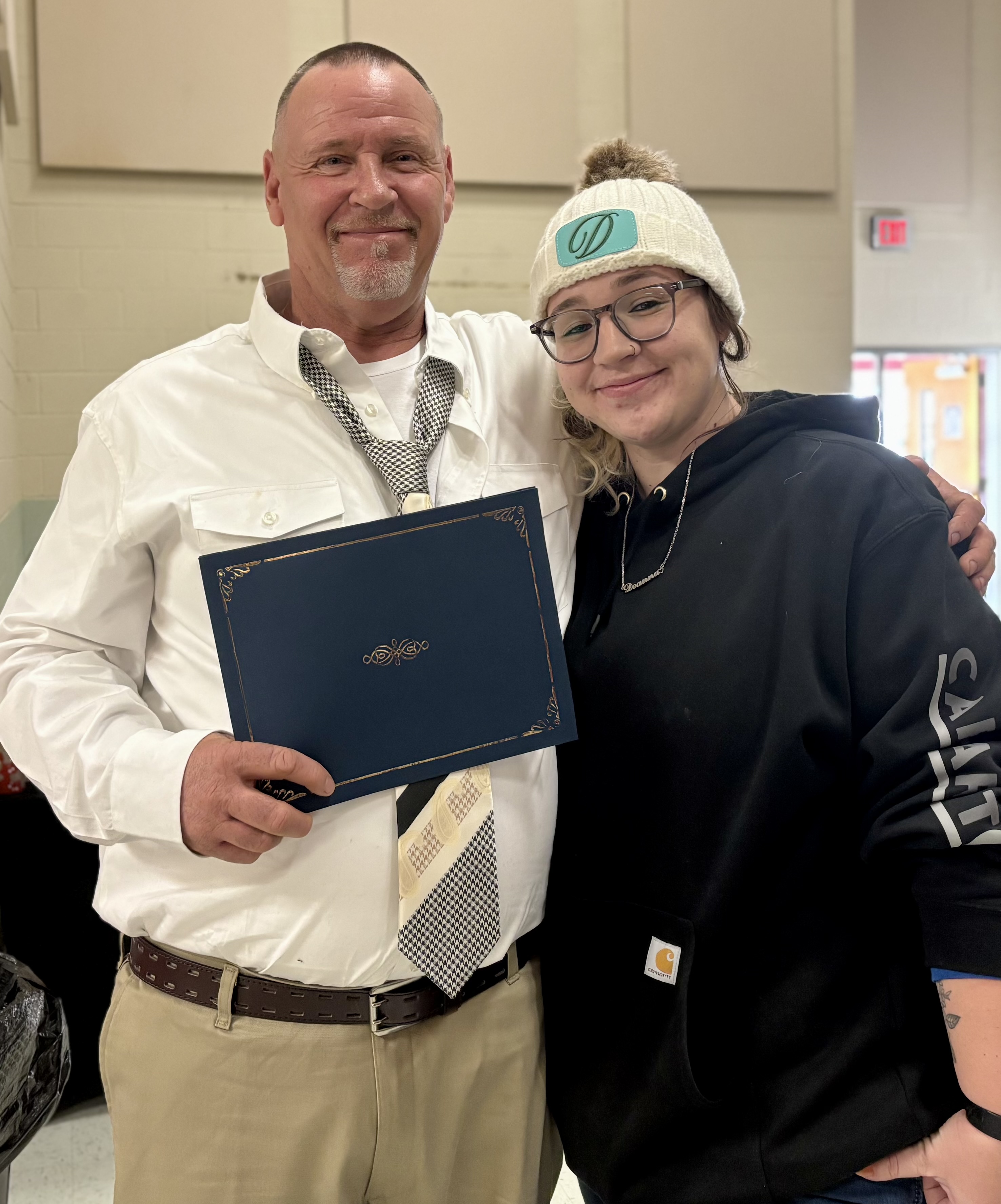 Dwaine Fowler and his daughter Deanna Lee Brooks Fowler share a moment together after he graduated from drug court on Dec. 11. Fowler spent 20 months in the program. (Photo/Submitted)