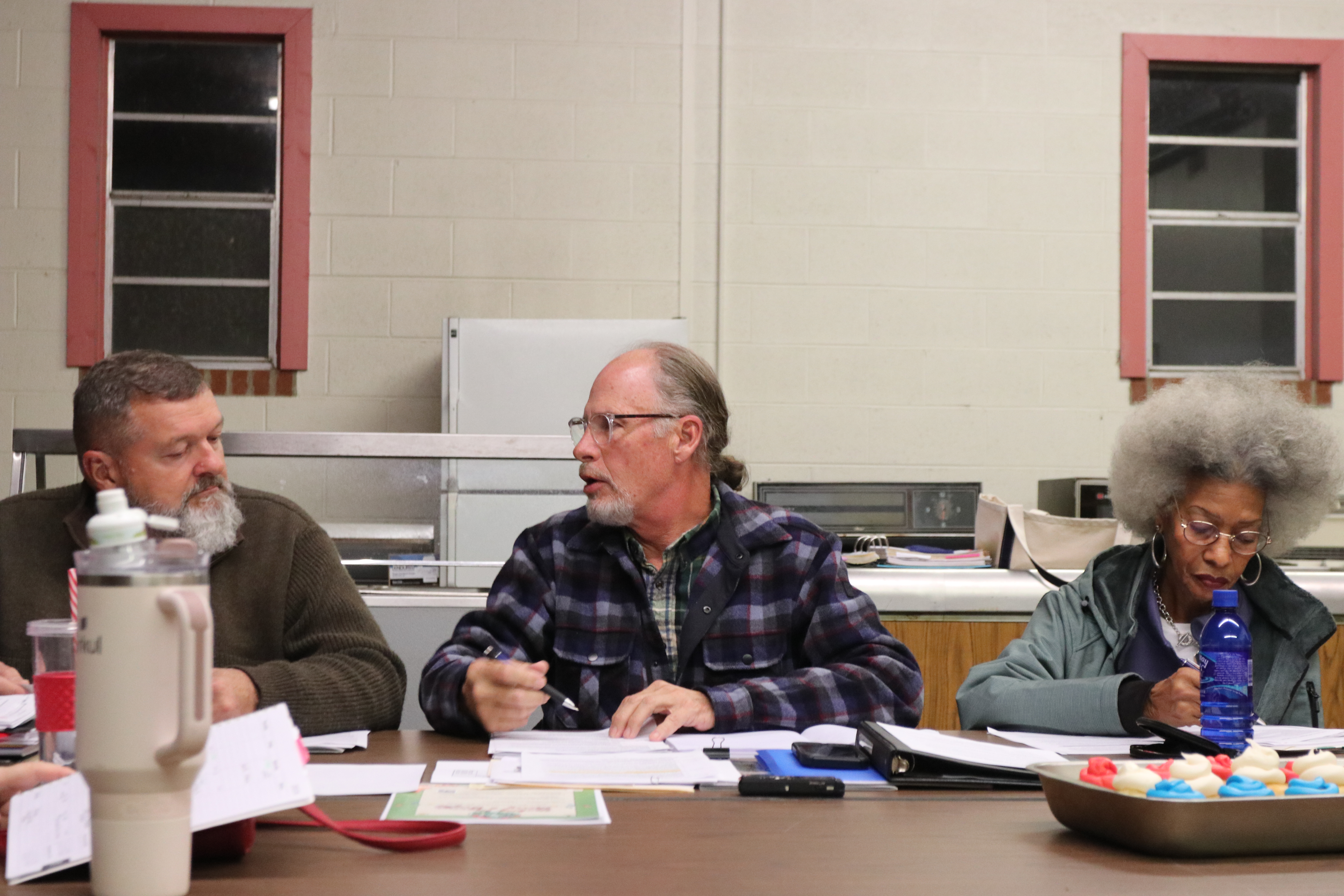 Mayor Edward Toledano (center) and city councilman Danny Gorman have a chat during a recent meeting at the Salem Volunteer Fire Department. City officials are looking into improving the water system. (Ansley Gavlak/The Oglethorpe Echo)