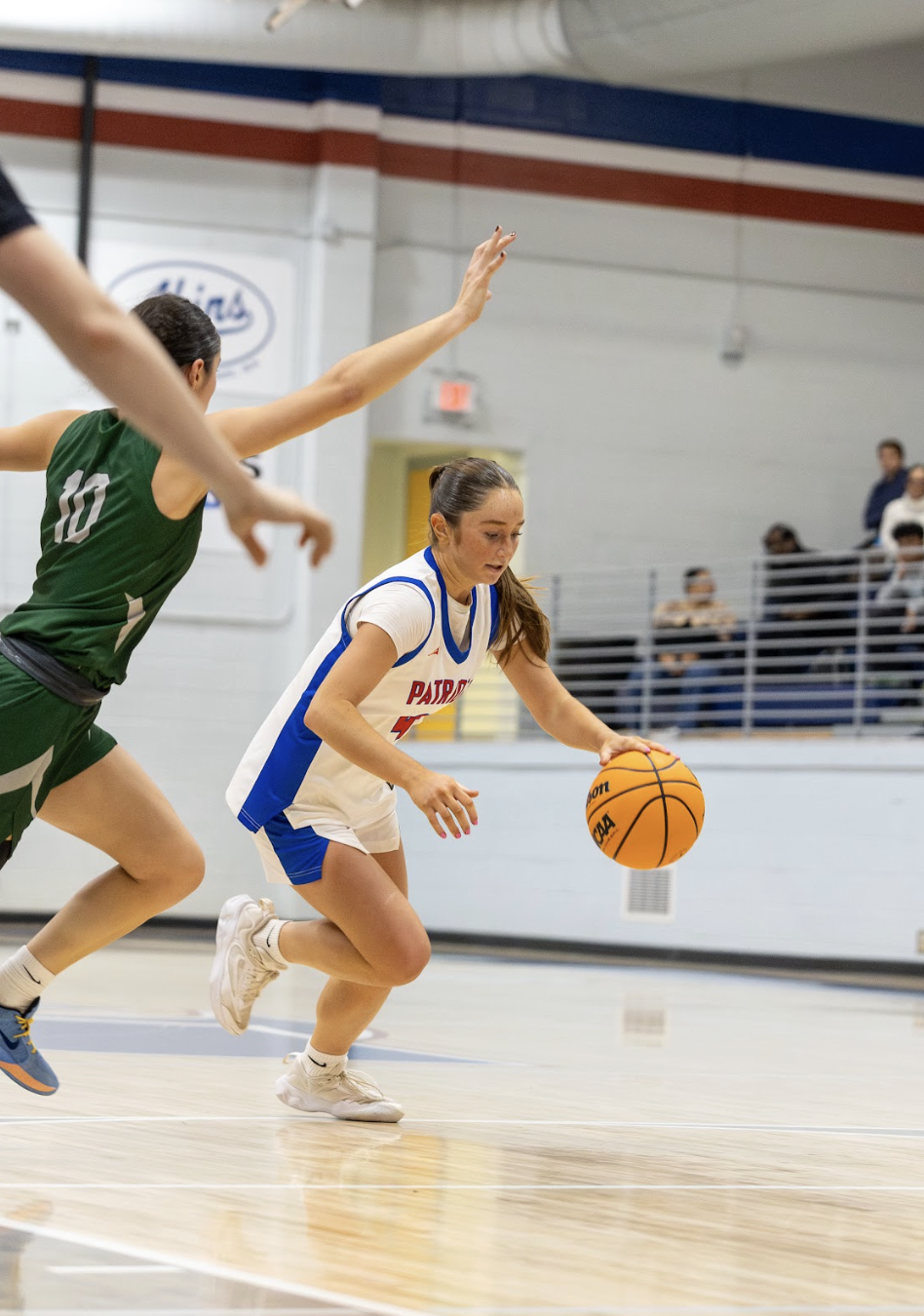 Elin Turner drives around an Athens Academy player in the Spartans’ 81-60 victory over the Patriots on Tuesday. The OCHS basketball teams don’t play again until Dec. 19, when they’re at Banks County. (Photo/Ty Johnston)