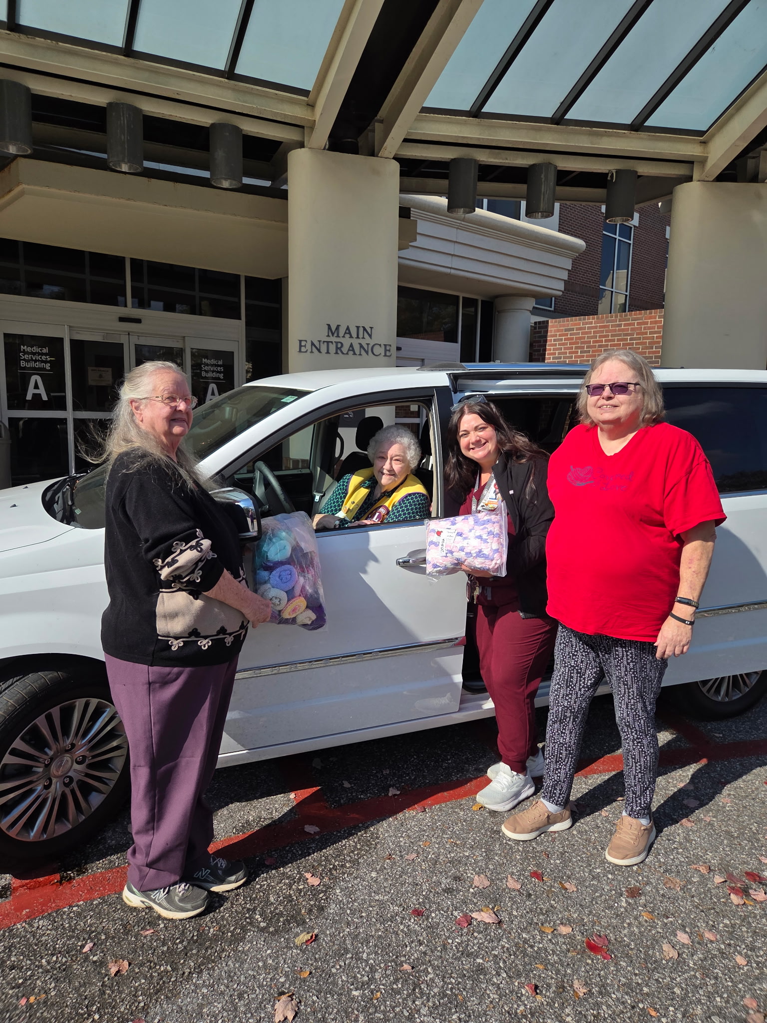 Peggy Spencer (from left), Corrine Thiel, Deanna Warren and Virginia Sanders smile after completing a donation at Piedmont Athens Regional Medical Center in December. It was their largest, with more than 200 pajama packs, 300 hats and 300 love worms. (Submitted Photo)