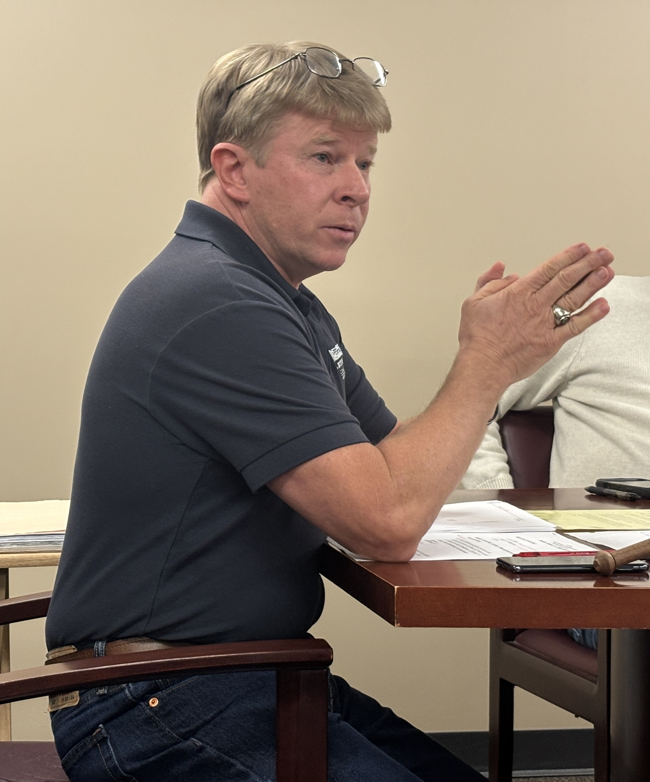 Jay Paul listens to a resident at the Board of Commissioners meeting on Monday. Paul, who is in his second term as chairman of the Board of Commissioners, would like to secure a landfill expansion permit this year. (Photo/Andy Johnston)