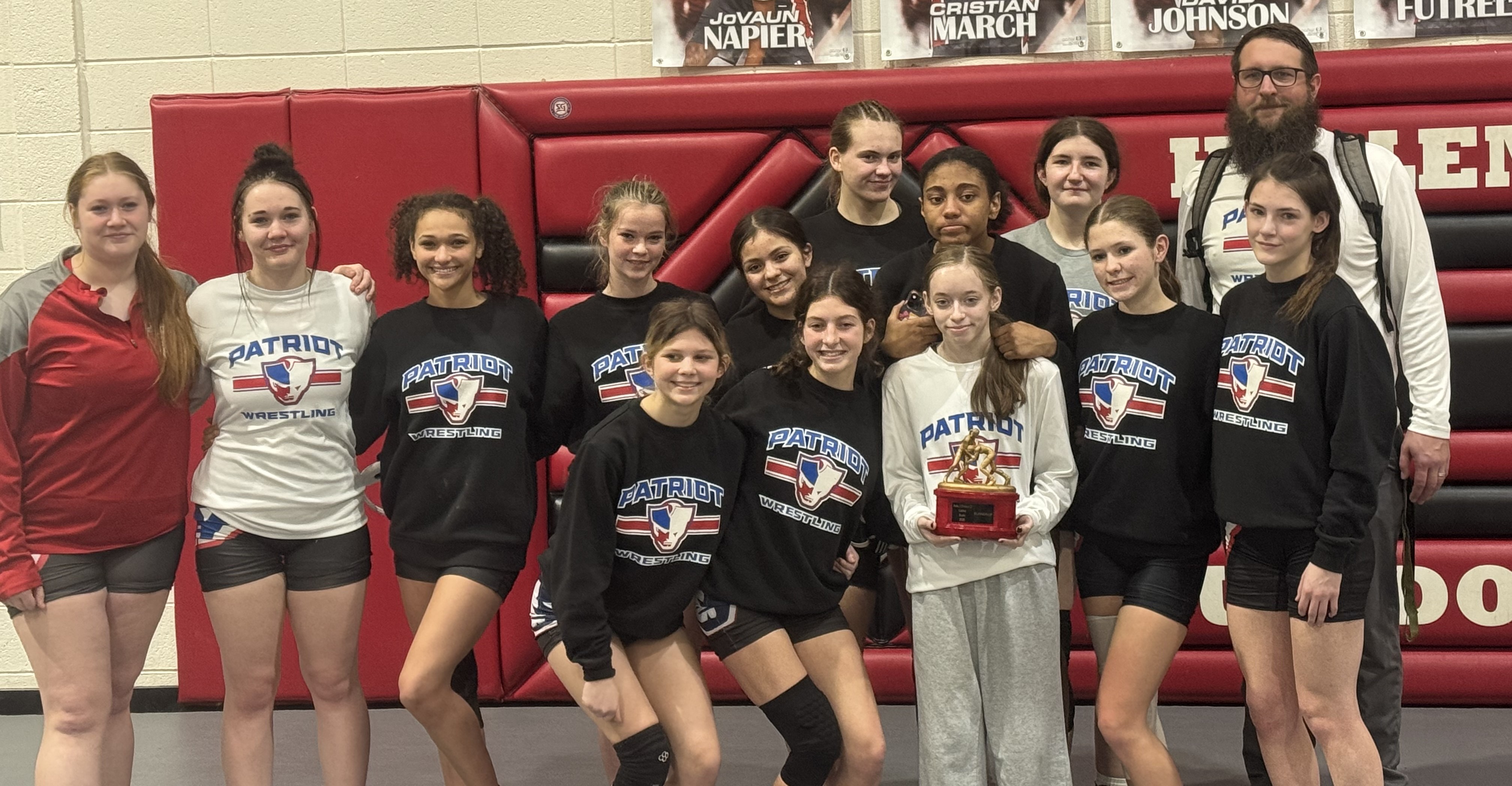 Members of the Oglethorpe County girls wrestling team include (from left): Mary Jane Miller, Victoria Miller, Akira Owens and Lannah Scarborough; (front, from left): McKinley Grimes, Emily Wisham, Lexi Bruce, Emily Gregory and Brooklyn Myers; (back, from left): Alondra Varges, Liz Campbell, Armonie Gresham, Alyson Woods and coach Josh Austin. (Submitted Photo)