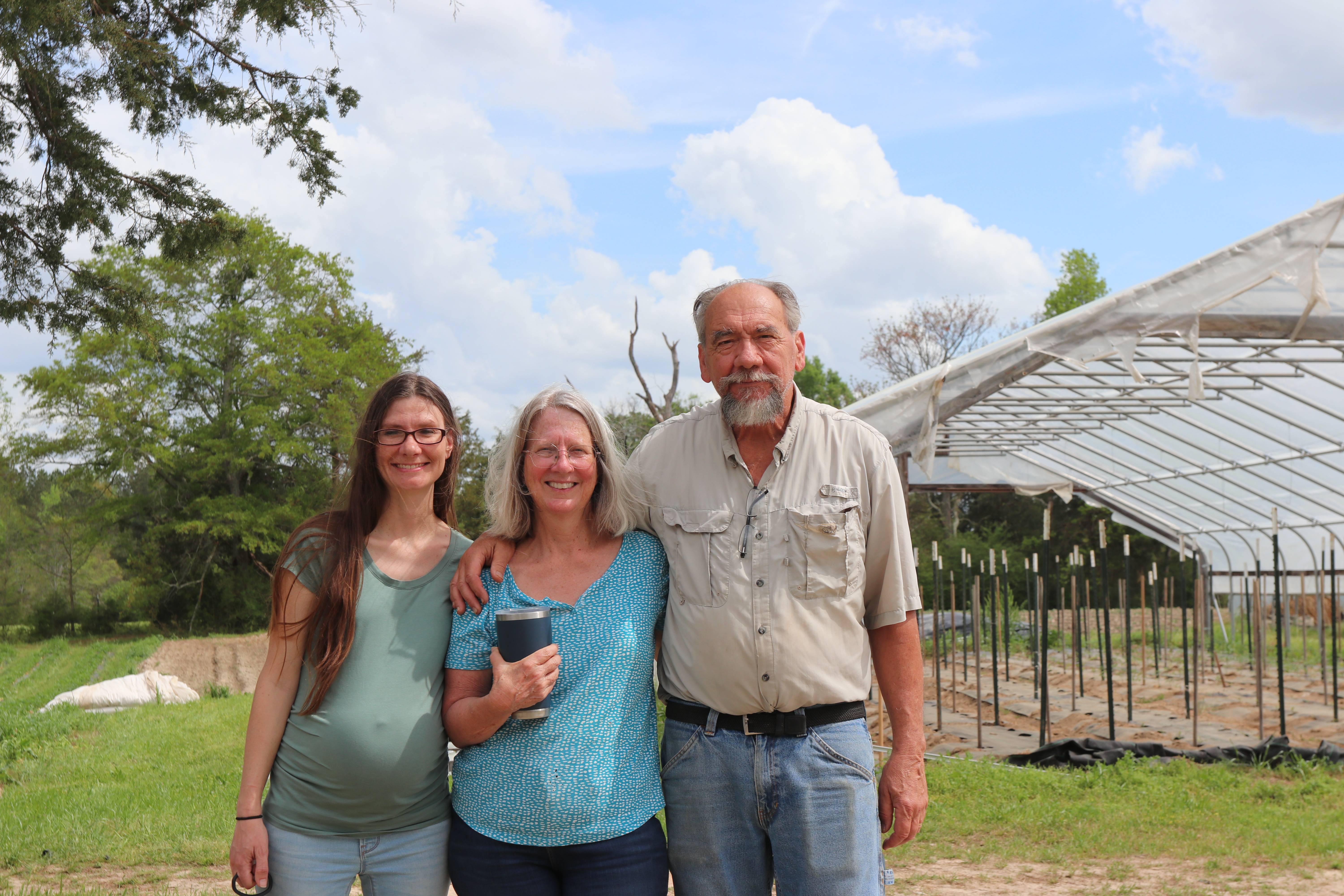 Jennifer Johns poses with her parents, Susan and Gary Shaw, at Hickory Hill Farms. The Shaws returned to Oglethorpe County in 1998, when Jennifer was nine, purchasing the land that had been in Susan’s family for generations. In 2009, they founded Hickory Hill Farms. Today, Jennifer’s three children will grow up on the same land that shaped both her and her mother’s upbringing. (Photo/ Lilly Stone)