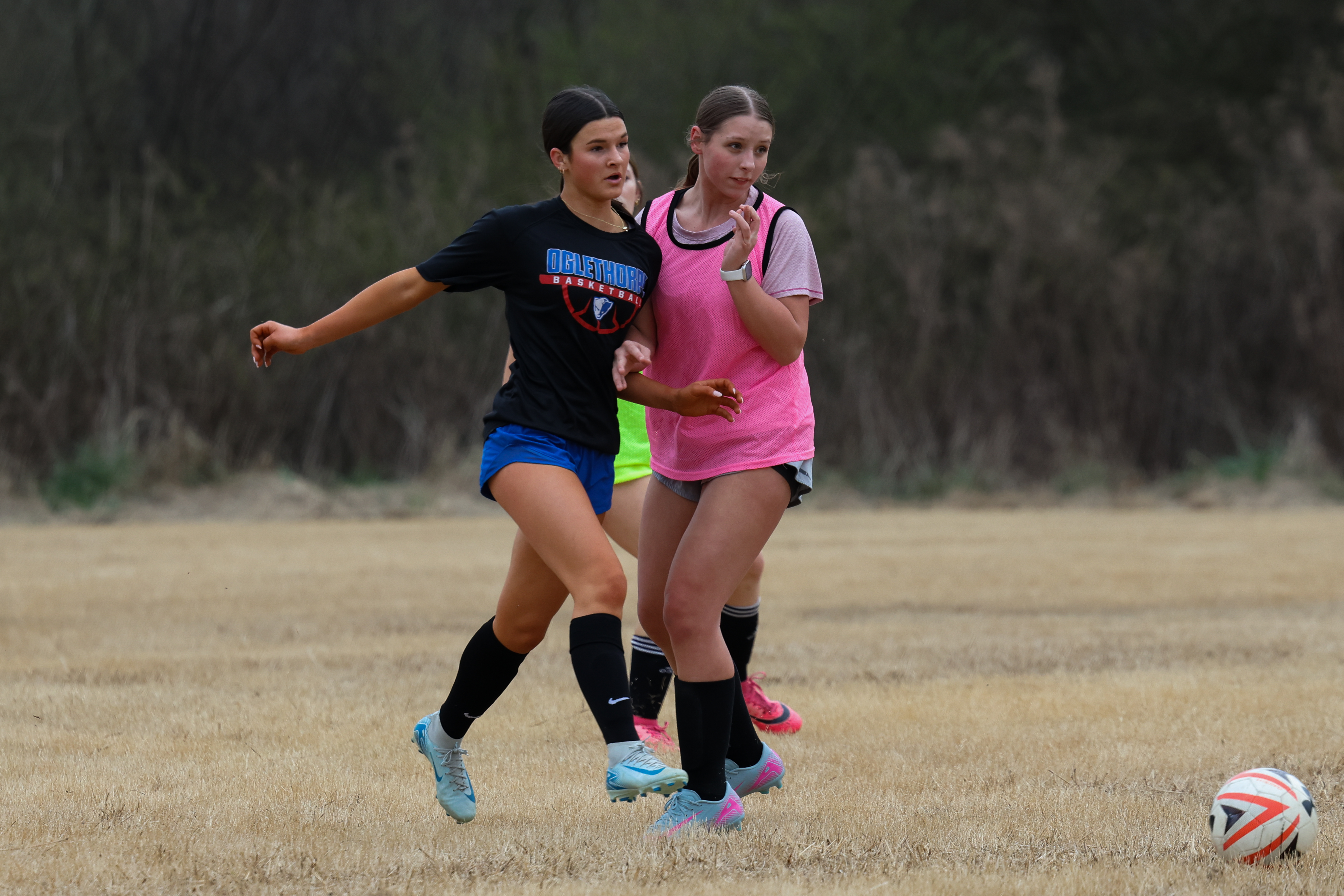 Khloe Eidson (left) and Kiley Paul (right) both fighting for a chance to get the ball. Both girls play with strong passion and care for their teammates and soccer. (Addison Simmons/The Oglethorpe Echo) 