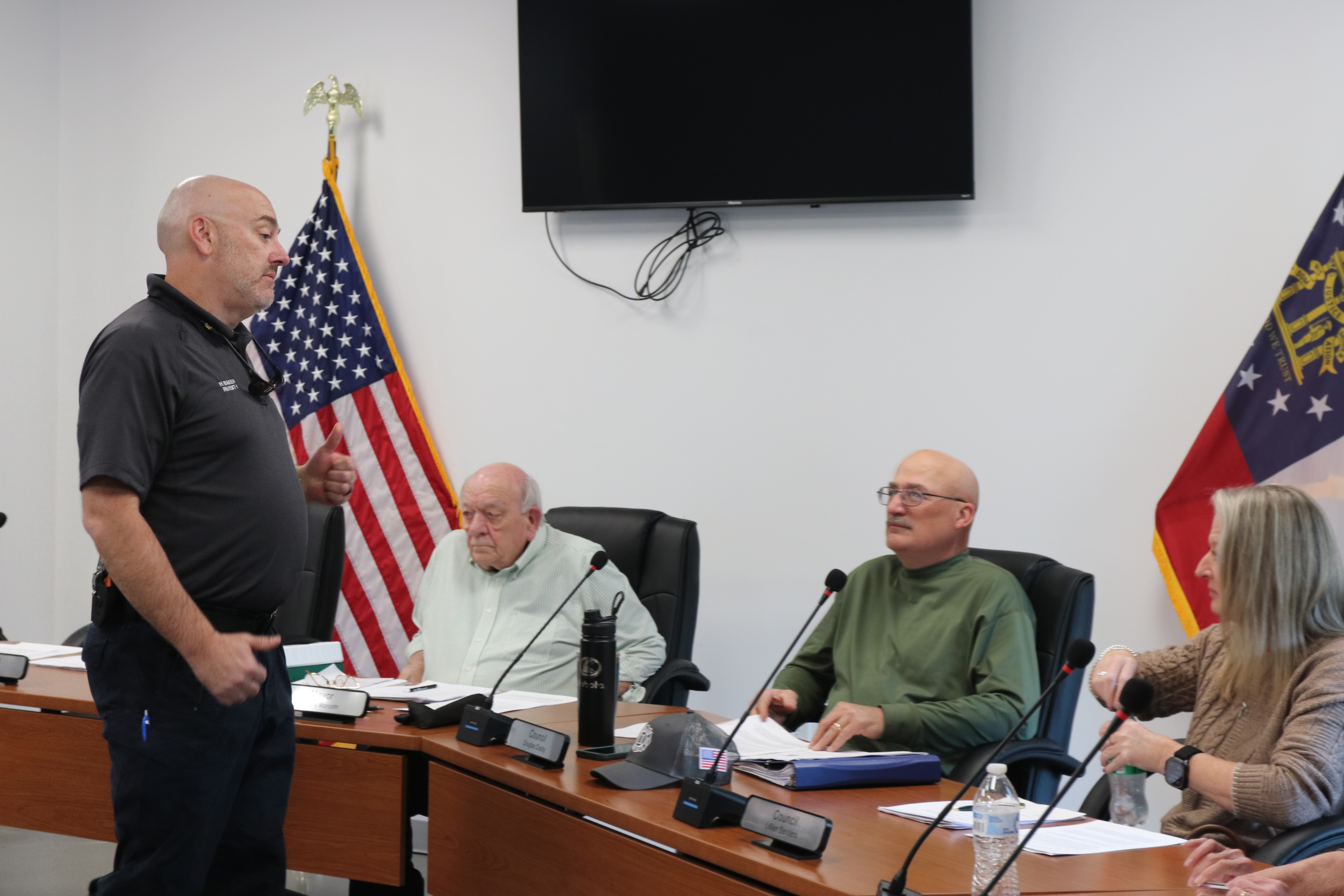 Arnoldsville Fire Chief Heath Baker gives a report to members of the Arnoldsville City Council during its meeting on March 19. The department plans to build an addition to the station. (Photo/Jessie Isaacs)
