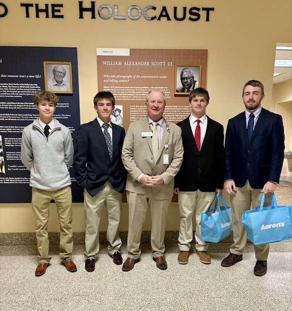 State Rep. John Corbett met OCHS students John Adams (from left), Lincoln Paradise, Jack Baldwin and Jake Huff at the Capitol on Feb. 25. OCMS student Camden Huff made the trip the previous day. (Submitted Photo)