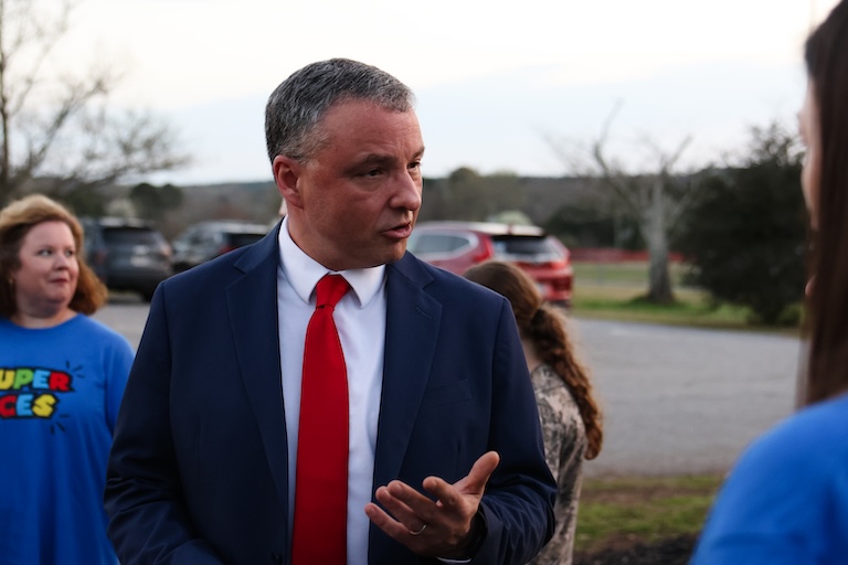 Phillip Powell talks to parents and teachers outside the Oglethorpe County School District on March 10, 2026, in Lexington. (Photo/Sydney Shankman)