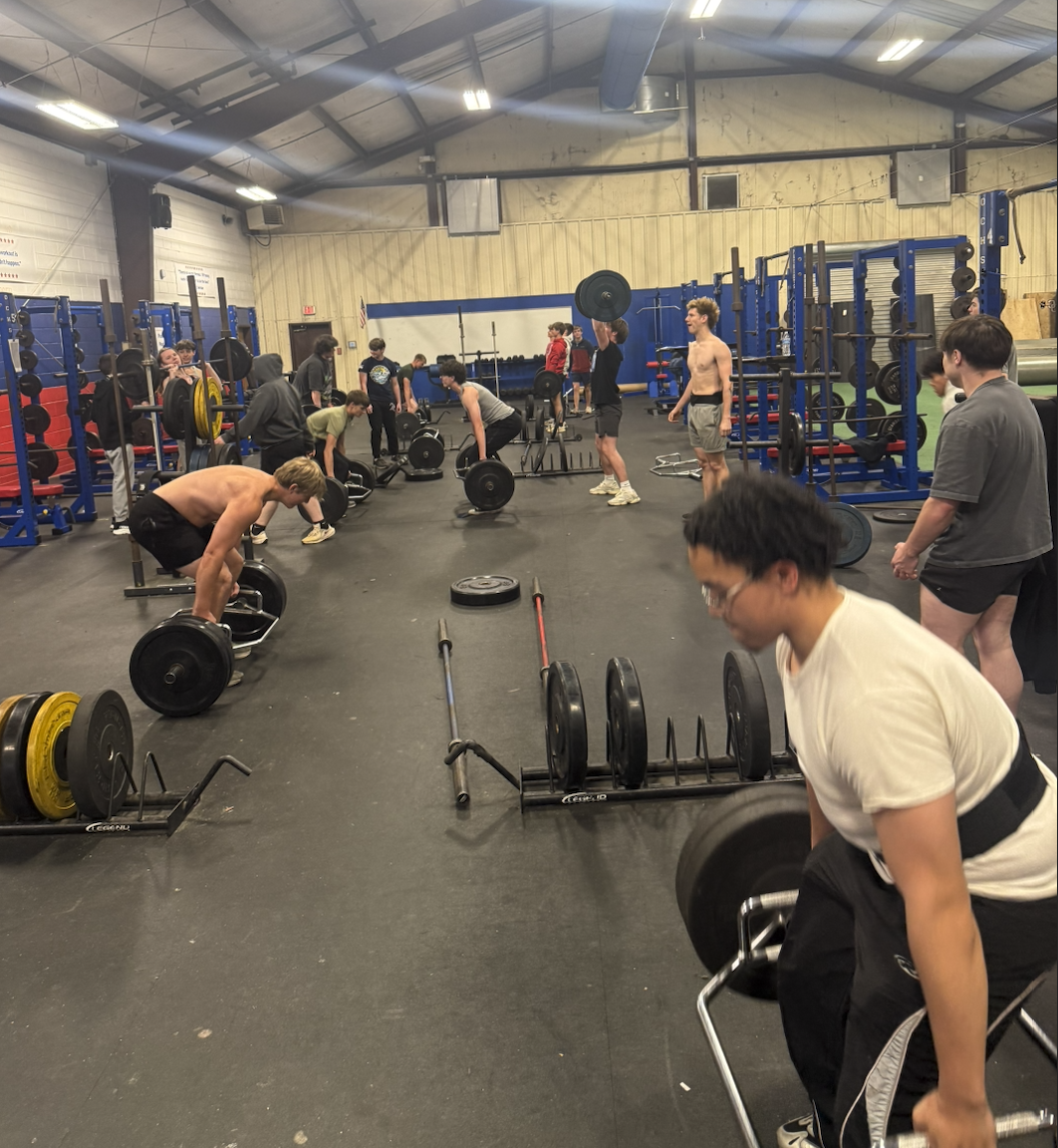 Students lift weights under the support and supervision of former teacher Steve Mason. Mason recently took a job at Commerce High School. (Submitted Photo)