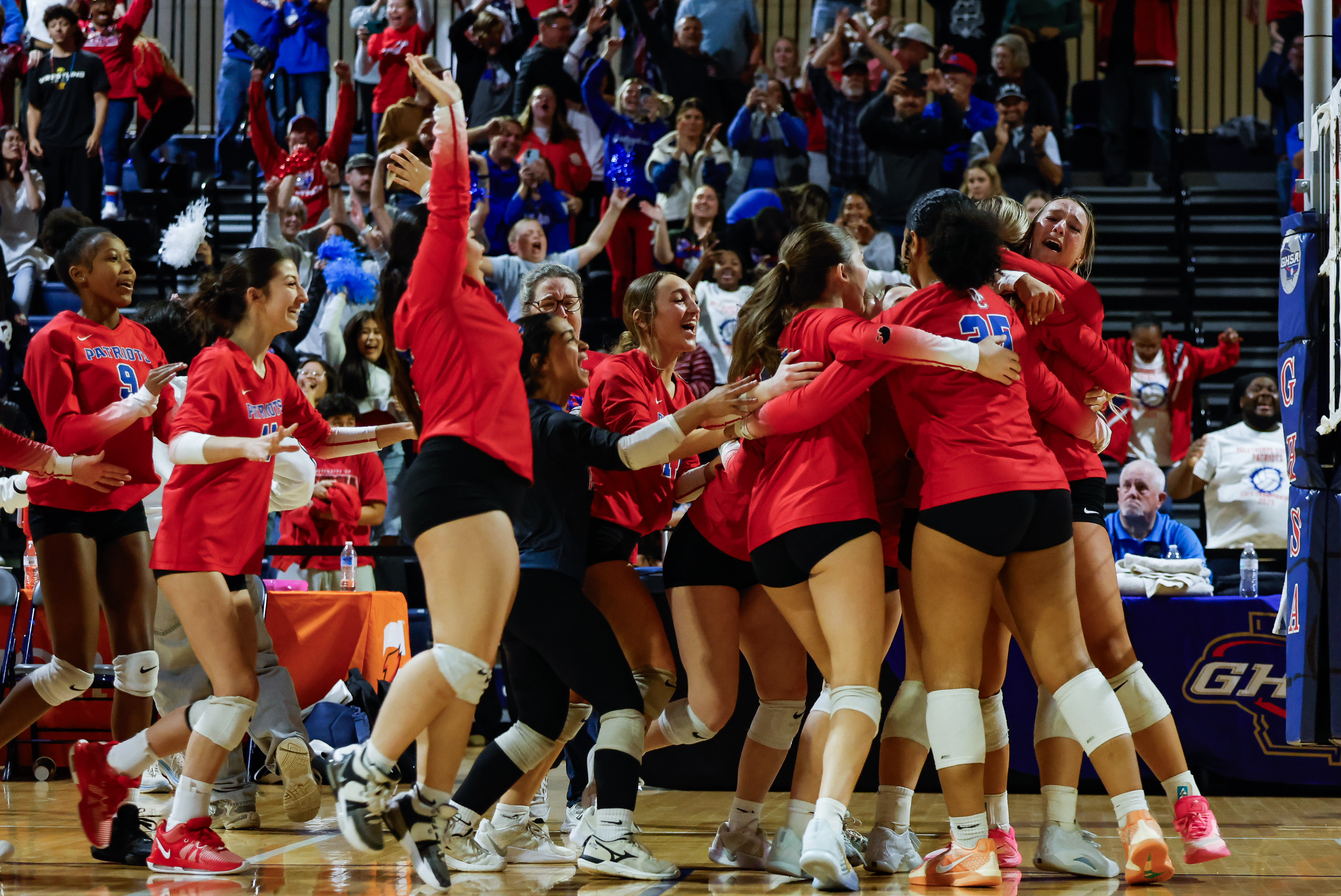 The Oglethorpe County volleyball team rushes the court after defeating Bremen to clinch the Class A state title on Oct. 29. It was the first volleyball state title in school history. (Photo/Drew Bearden)