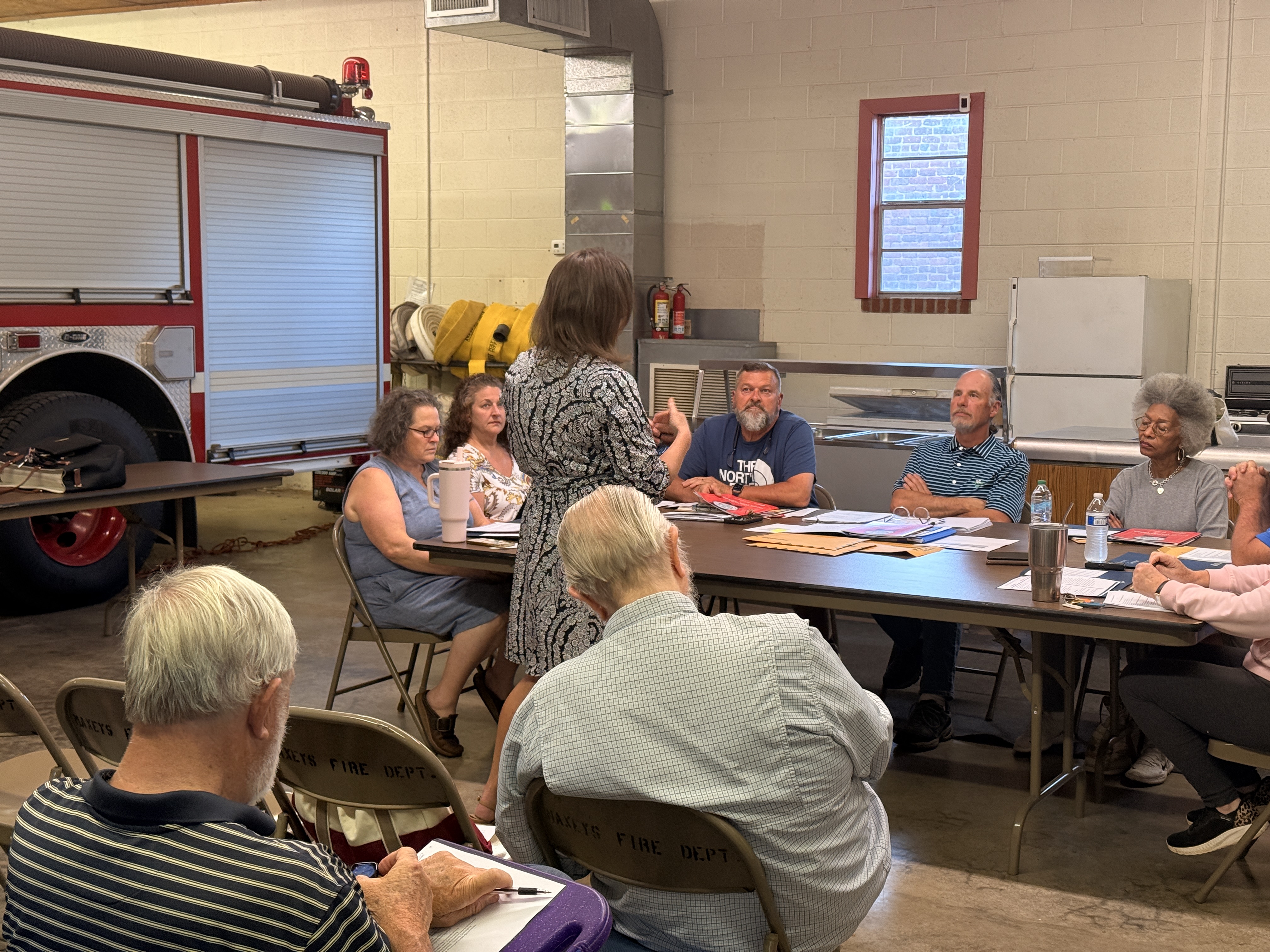 Georgia Municipal Association member services consultant Sherri Bailey speaks to Maxeys Mayor Edward Toledano (center) and the city council at Maxeys City Hall on April 14. She outlined the organization’s role in supporting cities in various ways. (Photo/Riley Baugh)