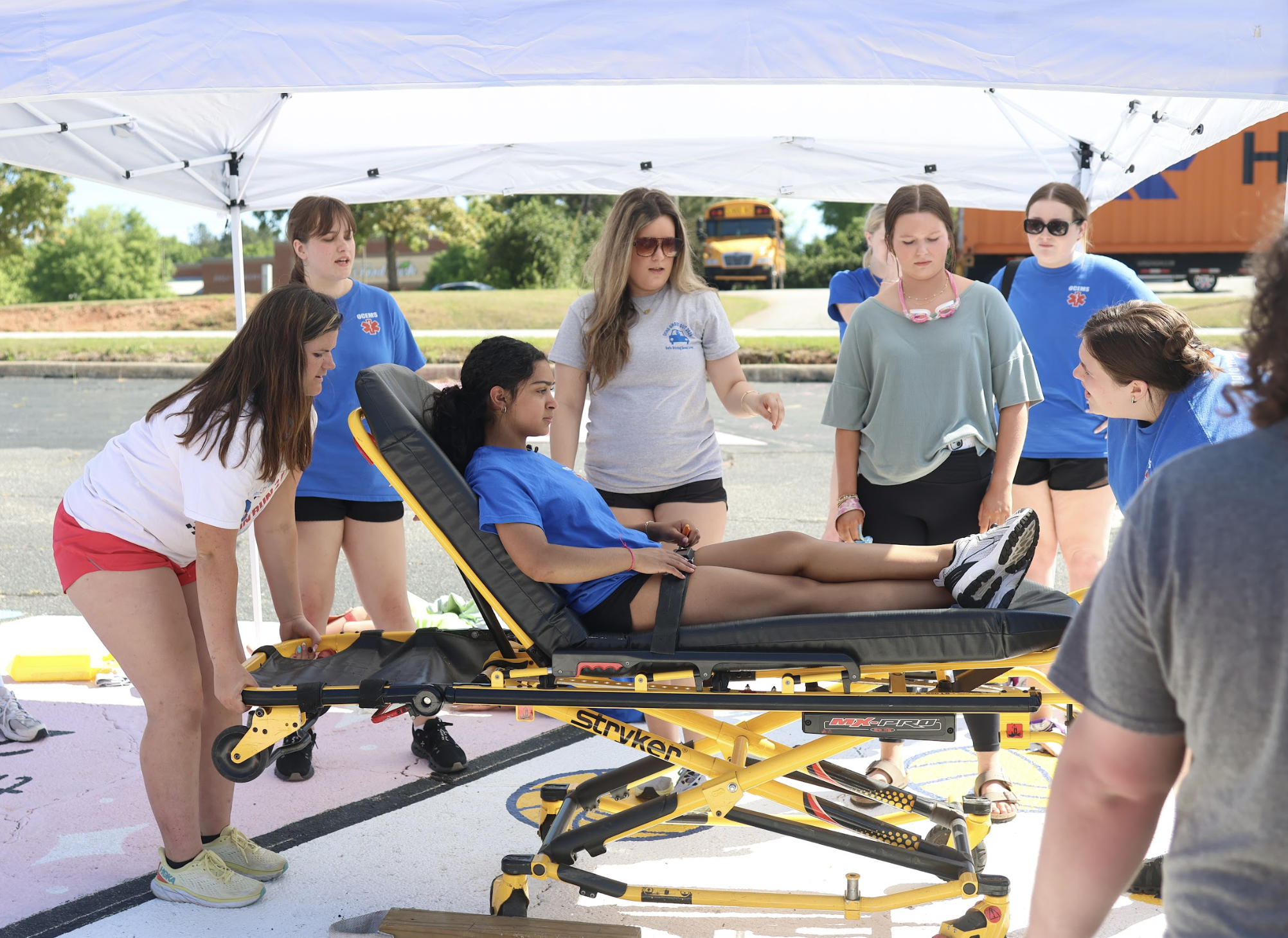 Students practice lifting and operating a stretcher during Ghost Out at Oglethorpe County High School on Friday. The activity introduced participants to emergency response techniques and the realities of crash scenes.(Photo/Kira Doppel)