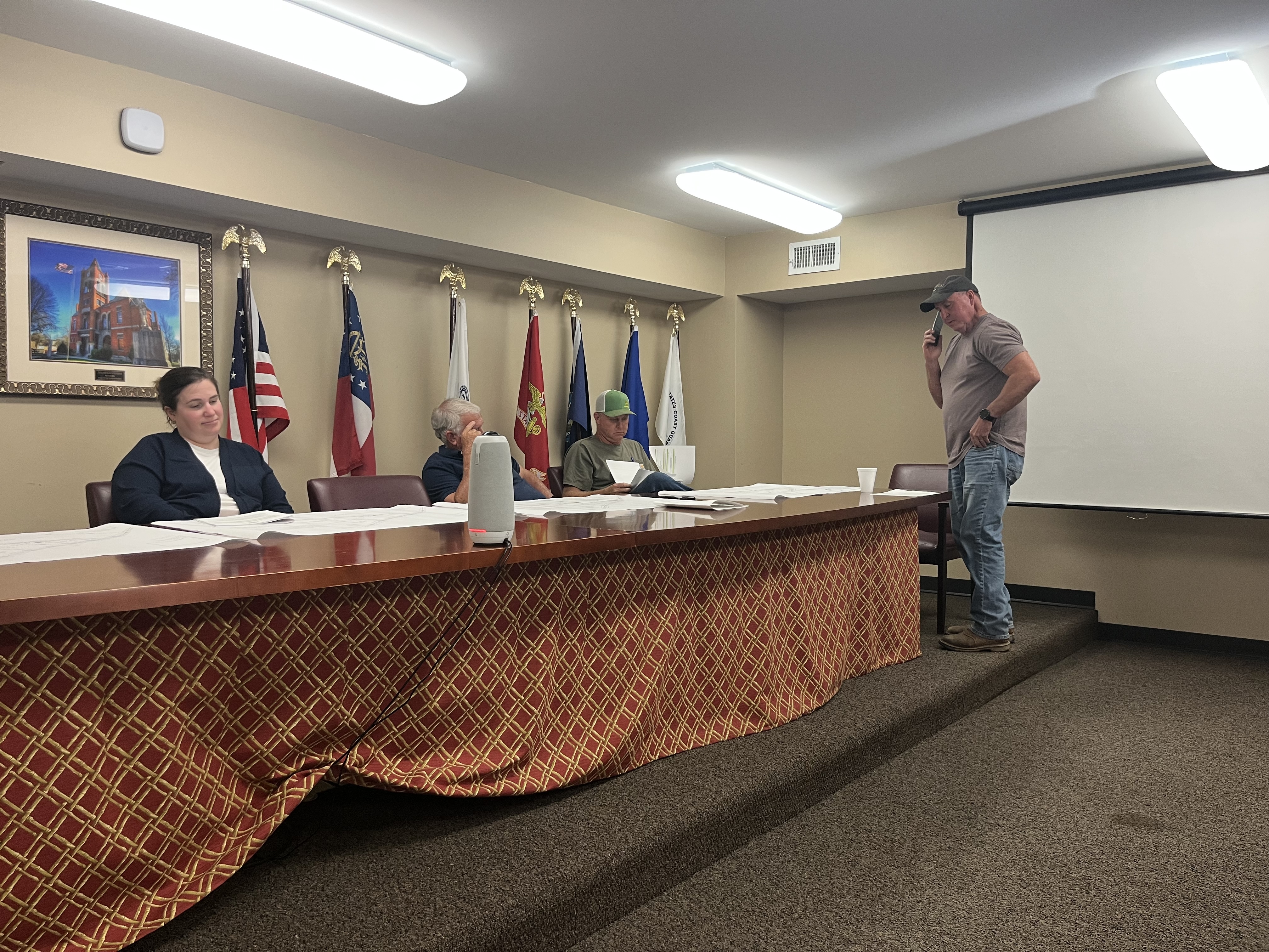 From left, zoning board members Morgan Robinson, Jimmy Shealy and Sam Nash, along with Planning Director Jeff Sharp, prepare for the April 16 zoning board meeting. Board member JF Hansford was absent. During the meeting, the board approved multiple zoning and land-use requests, including a proposal for a wedding venue and updates to county solar battery regulations, while denying one subdivision variance request. (Photo/Emilie Sullivan)
