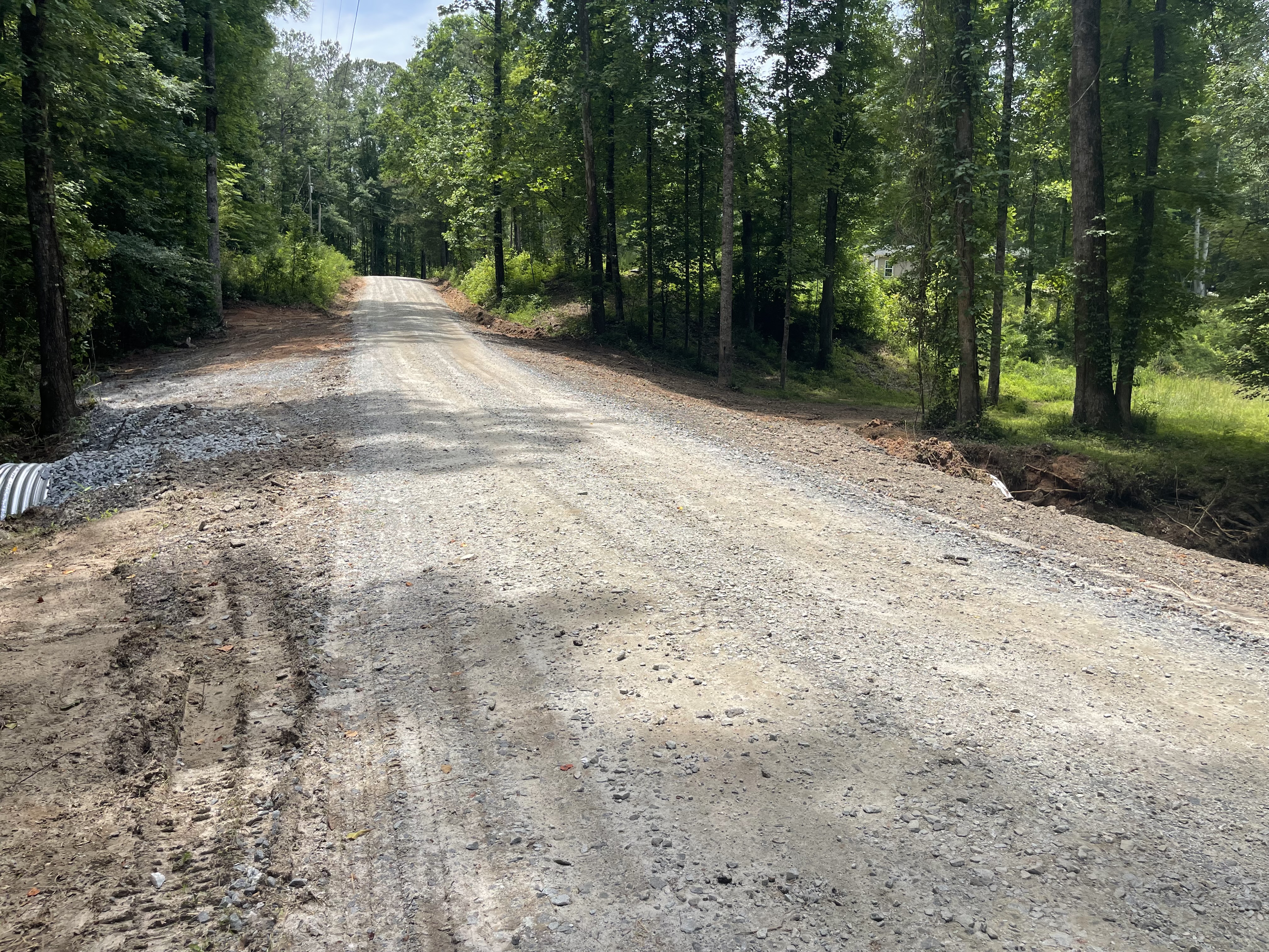 The newly repaired Emerald Green Drive. The Oglethorpe and Madison County works crews were able to get the road reopened on Tuesday, May 26, one day after it washed out. (Lexie Shadix/The Oglethorpe Echo)